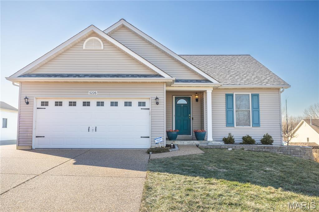 Looking for a great home in a wonderful area with top schools? Look no further than this 4 bed, 3 bath ranch in the heart of Wentzville. Cute kitchen with pantry, many cabinets, a movable island, coffee bar/desk & opening to the dining area. The dining area compliments the living room that has a vaulted ceiling, woodburning fireplace, & goes to the large deck, perfect for entertaining or just hanging out. The primary suite features a walk-in closet & double sinks, a shower, & garden tub in the private bathroom. There are 2 additional bedrooms and a full bath with shower and tub.  Rounding out the main floor is the laundry room, complete with storage & hanging space. The stairs to the lower level includes an electric chair lift. The lower level bedroom has a walk-in closet. The LL full bath has a shower.  The family room is large & has a walk out to the back yard. There is a kitchenette area with a fridge, wine fridge, & microwave that all stay. An extra room is perfect for an office or additional storage. The back yard has a large patio & deck & is fully fenced in.  The yard, including the front, also has an invisible fence. The house has a 2 car garage and aggregate driveway & walk way. Enjoy the subdivisions 2 pools, playground, clubhouse, & walking trails. The subdivision also adjoins the public schools including Timberland High School. Make your appointment today before the sign says SOLD.