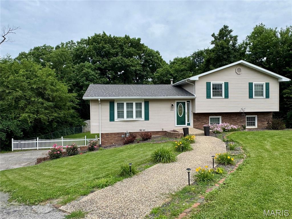Beautiful tri-level home located in a highly sought-after neighborhood! This spacious home features an attached two-car garage conveniently located at the base level. The main floor offers a large living room that flows seamlessly into the dining area and kitchen, creating a warm and inviting layout perfect for everyday living and entertaining.

Upstairs you will find three bedrooms, including a spacious primary suite complete with a private bath and large walk-in closet, along with an additional full bathroom.

The lower level features a fourth bedroom, a cozy bonus family/living area with access to the fenced backyard, and a convenient half bath with laundry area. This level also provides direct access to both the backyard and attached garage.

Enjoy outdoor living in the fenced backyard featuring a nice patio area and a storage shed for added convenience. This home offers space, functionality, and a fantastic location all in one package!