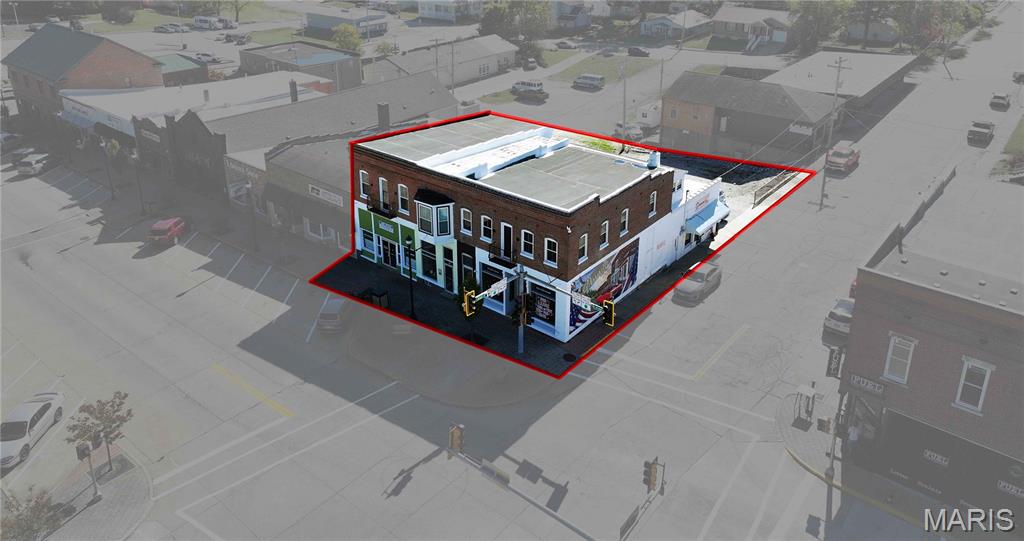 Historic Commercial Gem on the Square – 1859 Brick Building, Fully Restored & Modernized

Step into a piece of local history! Built in 1859 as the first brick building on the square, this remarkable commercial property beautifully blends timeless character with complete modern functionality. Every inch of this building has been thoughtfully updated while preserving its historic charm.

Property Highlights:

Fully replumbed, rewired, and reroofed — truly turnkey and up to code

HVAC system updated with central air, plus mini-splits for added comfort and efficiency

All new windows and complete tuckpointing inside and out for long-term durability

Trim lighting around the roof adds modern curb appeal to the historic façade

Water softening system is owned and professionally maintained through a service program

Additional lot space with direct access off S. Jackson Street—ample room for constructing an additional building, expansion, or added parking options

Currently houses three separate office spaces, an operating salon, and three Airbnb units on the upper level—providing immediate income potential

Interior Features:

Welcoming reception and waiting areas ideal for client interaction

Multiple private offices and break rooms for staff comfort and productivity

Functional layout suitable for professional offices, retail, hospitality, or mixed use

This building stands as a cornerstone of history—the first brick structure on the square—but offers the peace of mind of a fully updated, code-compliant property. With existing income-generating spaces and bonus expansion potential on the adjoining lot, it’s perfect for buyers who value historic charm, modern reliability, and room to grow.