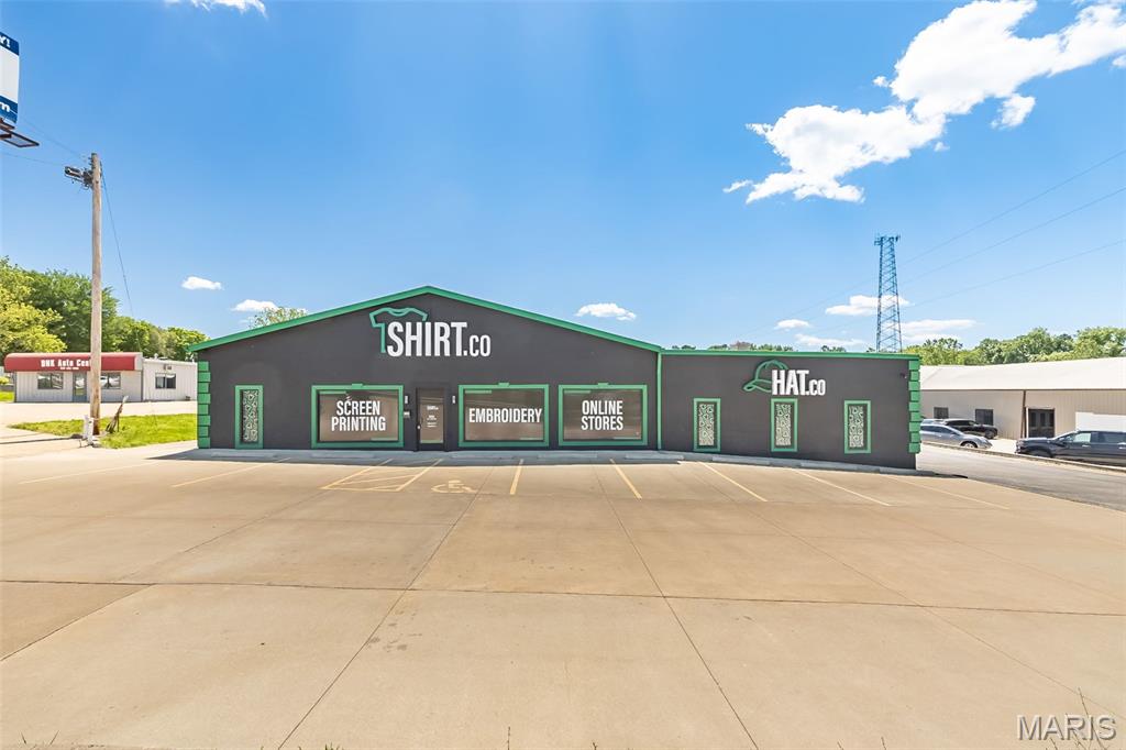Excellent location, great highway visibility, and quick and easy access to Hwy 364. Commercial, Retail, or Light Industrial stand alone building with over 15,000 SF on nearly an acre. Approximately 7,500 SF of office, showroom, meeting room space that is climate controlled, 5,000 SF of warehouse space is climate controlled and another 2,500 SF of warehouse space is heated. Building has 4 drive-in doors and a loading dock, 4 bathrooms, and approximately 30 parking spaces. Property is ADA Accessible. Zoned C-3.