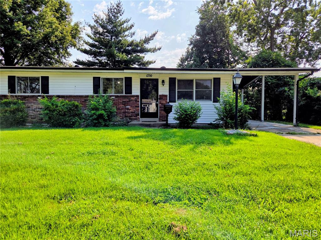 Desirable Florissant area 3 bedroom 2 full bath home near St. Ferdinand Park. Newly refinished hardwood floors in living room, hall, and bedrooms on main floor. Freshly painted interior. New vinyl tile (marble look) in eat in kitchen, bathrooms, and family room in lower level. Eat in kitchen with appliances that stay (electric stove/oven, and dishwasher). Two pantries in kitchen--one that's a large walk in pantry and the other a regular closet pantry with plenty of shelving for storage. Dry bar and electric fireplace in the basement family room makes it a great area of the home for entertaining guests and relaxation. Extra (4th) bedroom is in the basement with the 2nd full bath attached (2nd bath also has access from lower level family room). Level and well shaded fenced yard with shed. Carport. Convenient to shopping, restaurants, parks, public transportation, and highways.  Move in ready. Seller will pass City of Florissant occupancy inspection. You don't need a professional interior decorator to make this your dream home. The ai staged photos give you an idea of how to tastefully furnish this home to make it yours.