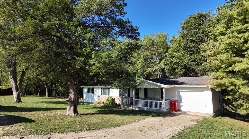 MOTIVATED SELLER!  Welcome to 301 Roberts Street! This inviting 4 Bedroom, 2 Bathroom home offers the perfect mix of comfort, convenience, and outdoor space. Enjoy coffee on the covered front porch, host summer cookouts on the back deck, and take advantage of the spacious yard spanning two property lots — perfect for pets, kids, or gardening. The attached 1-car garage provides secure parking and extra storage. Whether you’re searching for a starter home, more space for your growing family, or an investment property, this home has plenty to offer. Located in a quiet neighborhood with small-town charm, yet close to local amenities, it’s ready to welcome its next owner. Contact us today to schedule your showing!