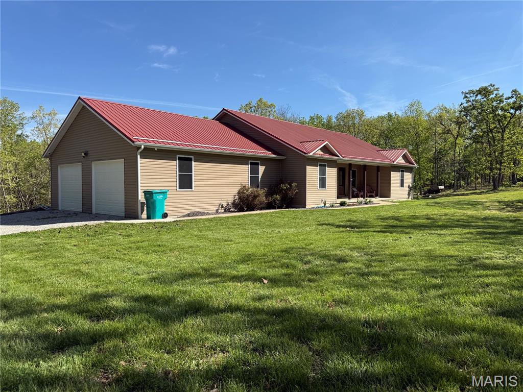 Built in 2017 and situated on 9 acres m/l, this exceptional 3-bedroom, 2.5-bath home offers the privacy and space buyers are searching for, while remaining just minutes from Steelville.
Step inside to find hardwood flooring, oversized living spaces, and quality finishes throughout. The custom kitchen features granite countertops, beautiful cabinetry, and opens seamlessly into the living room where a stunning custom built-in creates a warm and inviting focal point.
The spacious primary suite is designed to impress, featuring a massive walk-in closet and a luxurious en-suite bath complete with double vanities, custom tile work, a soaking tub, and a separate walk-in shower.
The thoughtfully designed floor plan continues with generously sized bedrooms, a full guest bath with double vanity, and a partially finished basement offering a workout room, abundant storage, and additional space ready for your future vision.
Outside, enjoy the best of country living from the oversized back deck overlooking your private acreage. Whether you're entertaining guests, watching wildlife, or simply enjoying the peace and quiet, this property provides the lifestyle you've been dreaming of.
