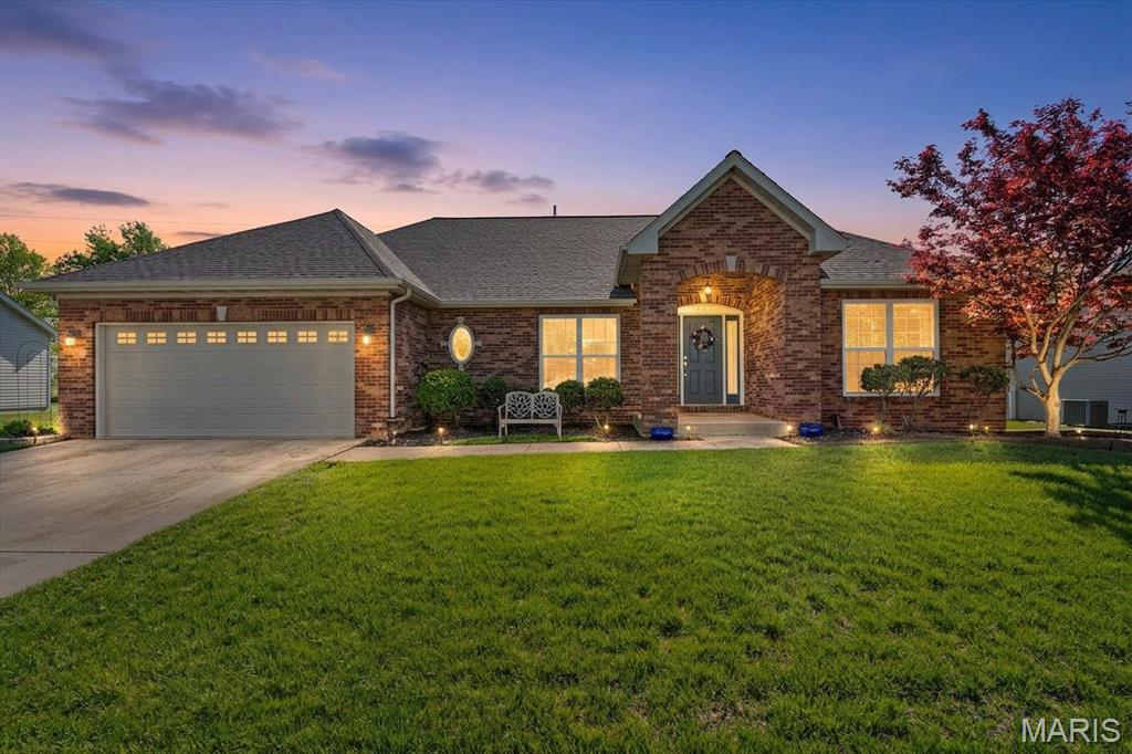 Imagine driving home through O'Fallon's prestigious Estates at Prairie Crossing. A scenic community lake sets a peaceful, upscale tone before you even pull into the driveway. That view is just the appetizer for 928 Saint Nicholas Drive. This gorgeous property pairs spectacular curb appeal with single-story convenience. The full-brick front facade commands attention while drastically reducing exterior maintenance. Inside, the ultra-open layout sweeps you away with bright spaces and soaring vaulted ceilings. It delivers an effortless main-floor living setup that feels grand and serves as the perfect layout to host social gatherings. Gleaming premium hardwood flooring runs seamlessly across the entry, living room, kitchen, and dining spaces. The core of the home features a cozy fireplace, a formal dining area, and a bright breakfast nook. Outfitted with classic oak cabinetry and granite countertops, the kitchen serves as your ultimate hosting hub. The peninsula features a raised breakfast bar, perfect for casual morning coffee. When the party winds down, the split-bedroom wing offers maximum privacy. Your primary retreat serves as a peaceful sanctuary, showcasing an elegant tray ceiling, an oversized walk-in closet, and an en-suite bathroom with a double vanity. On the other side of the home, two versatile bedrooms share an updated full bathroom. The main-floor laundry connects straight to your attached 2-car garage for a convenient mudroom transition. An open spindle staircase invites you downstairs to a massive basement matching the upper floor's footprint. It comes complete with a finished third full bathroom, a utility workspace, and a dedicated storage room, leaving an ultra-clean canvas ready for a home theater or gym. Out back, step onto your patio to discover a true hidden sanctuary. Situated on a premium lot with no rear neighbors, a white vinyl privacy fence completely secures the perimeter. At the center of it all is a sparkling, in-ground salt-water swimming pool built for quiet weekend relaxation. This prime location places you minutes from shopping, top-rated District 90 schools, the 200-acre Family Sports Park, and Scott Air Force Base. Don't let this paradise slip away. Call your agent today for a private showing, or swing by our Open House this Sunday!