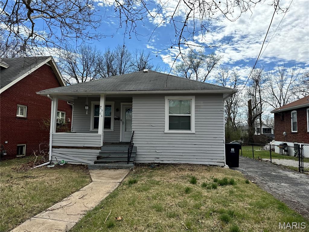 Fantastic investment opportunity awaits!  The exterior is in poor shape and needs work to the front porch and siding, etc., but the interior could be habitable after some general updating and cleaning.  Family room and dining room space is highlighted by luxury vinyl plank flooring, crown molding and stained glass windows.  The kitchen includes ceramic tile floors, white cabinets, stainless appliances and granite countertops.  Two bedrooms, one bathroom and a sunroom completes the main level.  The lower level is partially finished with rec room, bonus room/sleeping area, and laundry/storage which includes an updated electrical panel, PVC main stack and functional HVAC.  Home to be sold as-is/where-is and personal property will not be removed.  Seller to do no inspections, make no repairs and makes no guarantees regarding condition of property.  Special Sales Contract only.  There is no Seller's Disclosure Statement.
