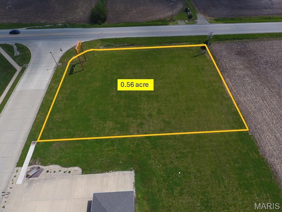 Commercial corner lot in the growing town of New Baden. This property is about 1 min off the I-64 #27 exit ramp on State Route 161. With 36,000+/- traffic count just down the road on the interstate. A new business could easily capitalize on this great location. The property is on a corner lot of a commercial road/subdivision entrance. Could be a great spot for a grab-n-go type business, fast food restaurant, coffee shop, nail shop, fitness center, & more. Next door is a tax/accounting business with Dollar General next to it. Location is in city limits with in the business district.