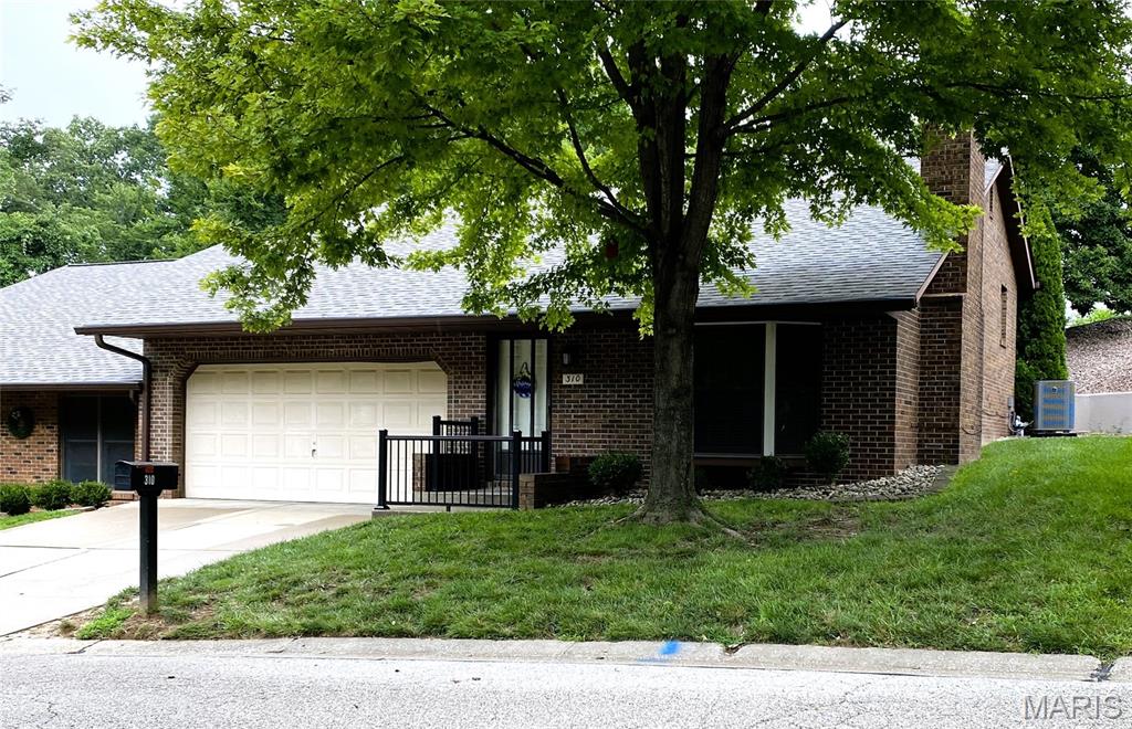 Located within a unique collection of properties in one of Collinsville's prime areas is this quality built, full-brick home. Positioned towards the rear of the desirable+private Pointe North neighborhood with distinguished+charming homes sits this perfectly placed end unit with a 2 car heated+cooled garage. Boasting tons of character, this property is anything but ordinary! Sit outside in your private screened in porch that is the entire length of the home and just relax for the day.  The show stopper of the home is the vaulted main level formal living room with floor to ceiling full masonry gas fireplace, stain glass window,  bay window, and the open staircase which provides a bright+airy feeling into the dining area. Big bonus is the new washer and dryer located right outside the primary bedroom. Have your agent show you the "secret" storage space conveniently located within this bedroom too. This area ,that will perfectly fit any king size bed, has connecting full ensuite with cute pocket doors and even has 2 showers. The wall of walk in closets and direct access to the screened in porch is sure to be a favorite feature. Your guests are going to absolutely love the lower level! With daylight windows, all of the natural light allowed in, you will never feel like you are in a basement. THE LOWER LEVEL IS PERFECT FOR ENTERTAINING! This area has a FULL 2nd KITCHEN with bar, full bathroom, and a bedroom with large double wall of closets. The bonus area is perfect for many uses; home office, bourbon/wine bar, crafts, home gym, theater, etc. Piece of mind during this extreme heat comes with the NEW HVAC that was recently updated. If you have been searching for a home loaded with character, this property is a must see for you! This end unit residence in an owner-occupied only community is much more spacious than it looks from the front lawn. This home was designed to be SIMPLY STUNNING and is perfectly priced for you to make it your own! Agent interest.