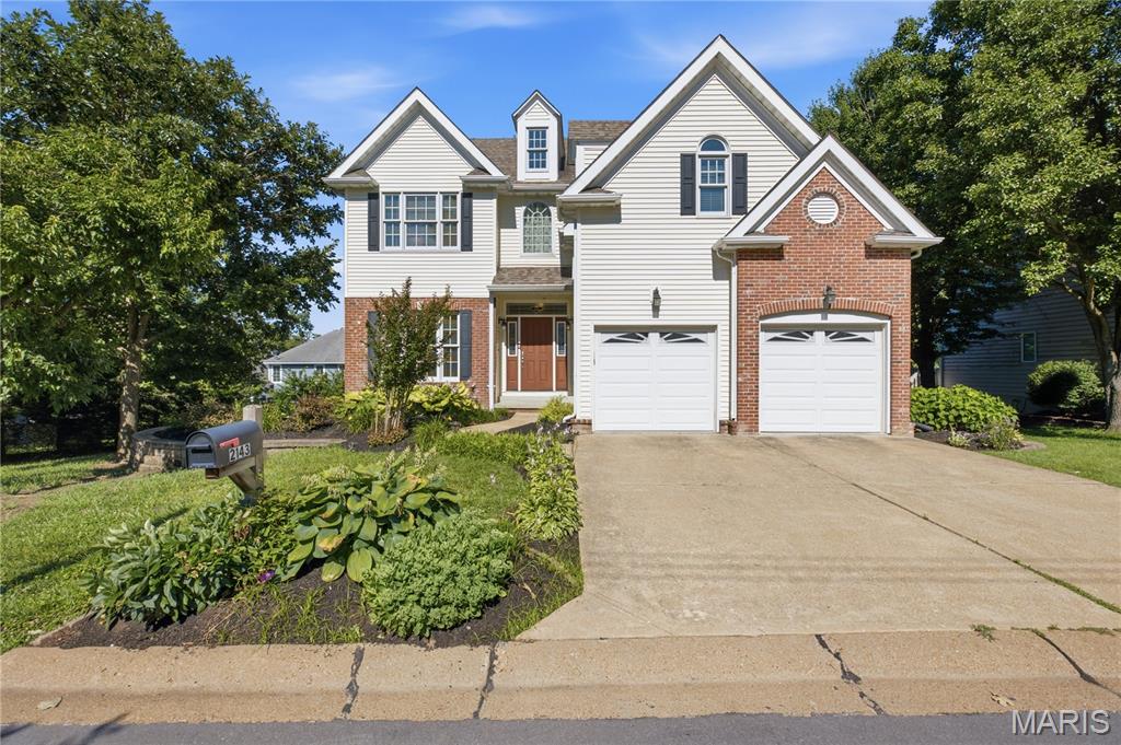 Nestled in the community of Crystal Lake Park and located within the highly sought-after Ladue School District, this exceptional newer construction home offers the perfect blend of timeless charm and modern living. Built in 2005, this residence showcases beautiful architectural details, abundant natural light, and a thoughtfully designed open floor plan ideal for today’s lifestyle.
The impressive two-story Great Room serves as the heart of the home, featuring a fireplace, built-in bookcases, and expansive windows that fill the space with light. The formal dining room is perfect for gatherings and holiday celebrations, while the sunny eat-in kitchen boasts a center island, custom cabinetry, and seamless access to outdoor entertaining spaces.
A flexible main floor bedroom—complete with an adjoining full bath—offers the perfect option for a guest suite, home office, or study. Upstairs, the primary suite is a true retreat, featuring a coffered ceiling, private sitting room, and an expansive walk-in closet. Two additional bedrooms and a conveniently located second-floor laundry room complete the upper level.
The finished walk-out lower level is equally impressive, offering a bright and inviting third living space with large windows, a spacious recreation room, an additional bedroom, and a full bath—ideal for guests or extended living.
Step outside to enjoy multiple outdoor spaces designed for entertaining and relaxation, including two decks and a patio, all set on a beautifully positioned lot. 
Ideally located between Frontenac and Town & Country, this home offers easy access to Plaza Frontenac, West County Center, and some of the area’s best dining and shopping. Enjoy the charm of a quiet, established neighborhood with nearby walking areas and a family-friendly park.
With over 3,700 square feet of living space, 5 bedrooms, and 4 full baths, this is truly a rare opportunity to own a beautiful home in one of the area’s most desirable communities.
Welcome home to 2143 Oak Drive.