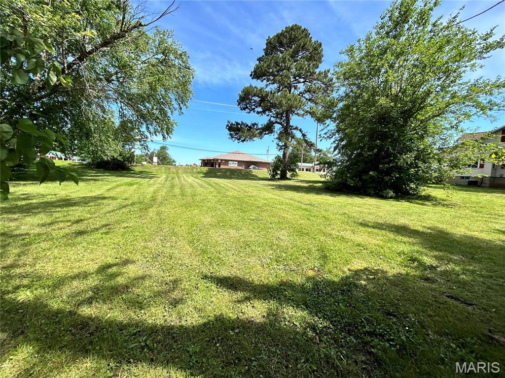Commercial land on HWY 66! Here’s your chance to acquire over 13,000 square feet, strategically located on one of Sullivan’s busiest streets. Boasting around 108 feet of frontage along Springfield Road and offering alley access on two sides, this property holds significant potential. With its current C3 zoning, it stands as an ideal location for constructing a professional office building or a multi-family residential complex with easy access option. Location: Corner Location, High Traffic