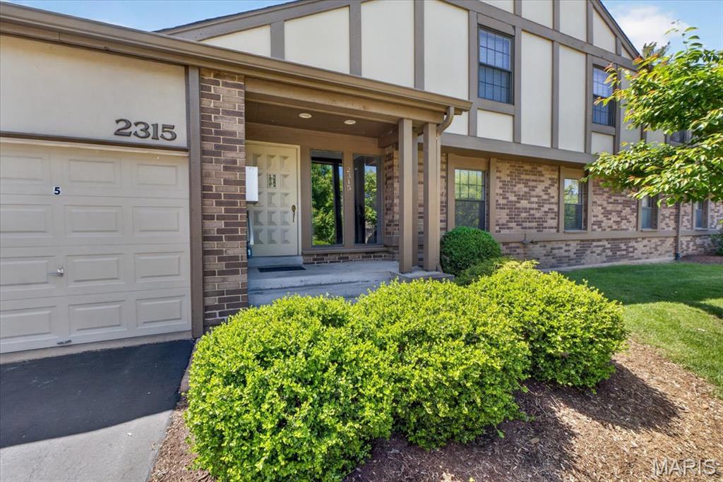 Ground-level condo offering one-level living with 2 bedrooms and 2 full baths, located in a secure building. This unit is move-in ready with fresh paint and new carpet throughout!  The living room has bright natural light with sliding glass doors that open to a private patio with views of trees and common ground. The living room adjoins the dining area for a functional, open layout.  The updated kitchen also has direct access to the patio and offers stainless steel appliances (refrigerator stays), granite countertops, tile flooring, tile backsplash, and a pantry.  The primary suite includes two closets (one walk-in) and a private bath with a new vanity. A second bedroom and full bath provide flexible space for guests or a home office.  Additional features include in-unit washer and dryer (both stay), a one-car attached garage, and a 10x10 storage unit in the basement.  Enjoy maintenance-free living with amenities including a pool, clubhouse, and tennis court. Monthly fee also covers snow removal, mowing, exterior maintenance, sewer, trash, and water.  And a wonderful location next to Creve Coeur Park and Lake.