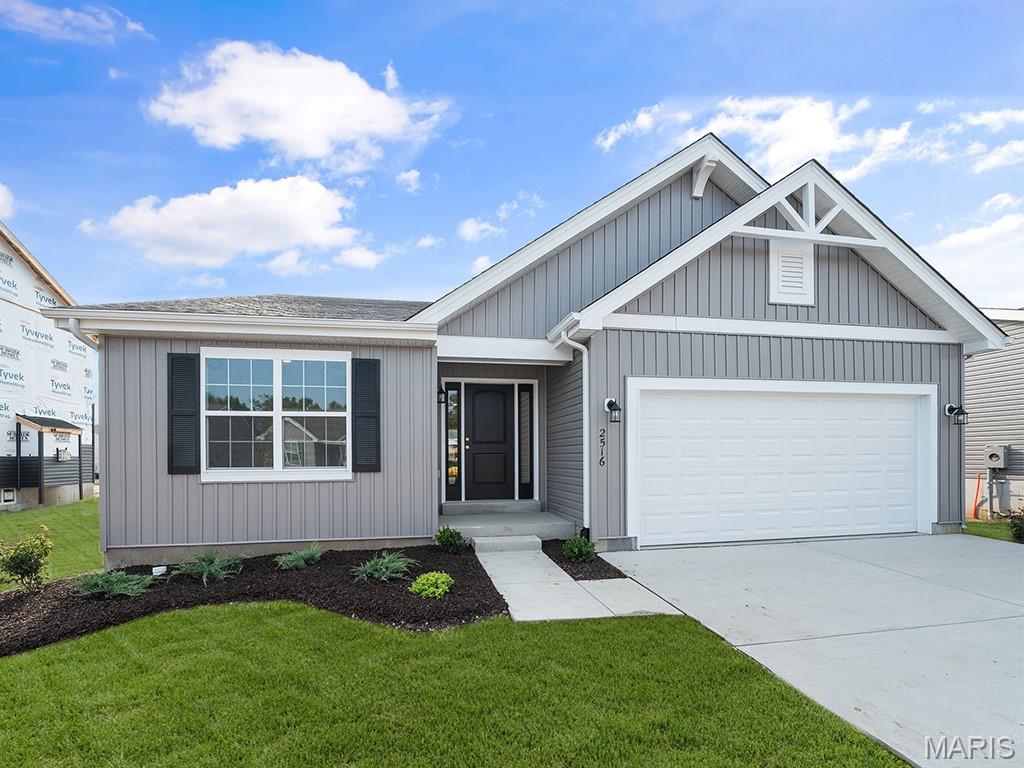 New McBride Homes Aspen II 3BR, 2BA ranch move-in is ready now! Walkout homesite & farmhouse exterior! An open floorplan w/vaulted ceilings, 6’ windows, & wood laminate flooring in main living areas. The kitchen has a large island w/ breakfast bar, level 4 Brellin White 42” cabinets, quartz countertops, stainless steel GE appliances, & walkin pantry. The dining area has a sliding glass door that leads to a covered future deck area. The primary suite has a large window, dual closets, & private bath w/double sinks & walkin shower. 2 extra bedrooms & a full bath add convenience. Extras: main floor laundry, ¾ bath rough in at LL, matte black fixtures & 6 panel interior doors. Winding Meadows offers new homes w/a serene country feel, minutes from Gravois Bluffs & in the Northwest School District. With easy access to Hwy 141, 30, & I-270 for shopping/entertainment. Enjoy peace of mind with McBride Homes’ 10 year builders warranty & incredible customer service! Similar photos shown.