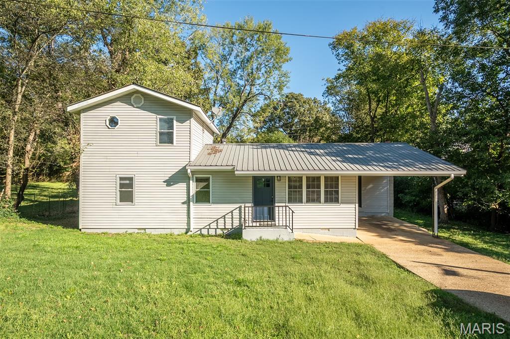 This beautifully remodeled 3 bedroom, 2 bath home offers a perfect blend of modern comfort and small-town charm. Located within walking distance of the Doniphan school and just five minutes from the beautiful Current River, it provides both convenience and access to one of the area’s most scenic natural attractions. The home has been fully updated with fresh finishes throughout, featuring a bright open living area, new flooring, updated kitchen and baths, and a clean modern look. Outside, you’ll find a large backyard that’s perfect for family activities, pets, or entertaining guests. The spacious deck offers a relaxing outdoor space with a nice view of the yard. A single carport provides convenient covered parking, and the overall property has a very neat, move-in-ready feel. This is a great opportunity for anyone looking for a nice, clean, and fully refreshed home in a great location close to schools and the river.