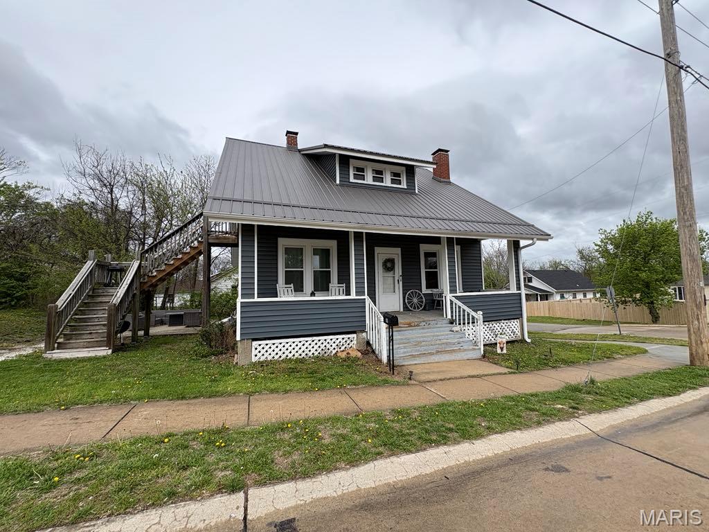 Updated where it counts and full of character you can actually feel, this 1.5-story home in the heart of Warrenton brings together classic detail and everyday comfort.

Major improvements include new siding, windows, roof, gutters, and HVAC in 2024, along with a refreshed kitchen, paint, and carpet in 2022. With 1,762 square feet, the home offers warm, inviting spaces centered around a cozy fireplace, while arched openings, built-in shelving, and original trim add personality that stands out from newer builds.

The kitchen provides ample cabinet space and room for dining, while large windows throughout bring in natural light. A full unfinished basement gives you plenty of storage or the option to expand over time.

Outside, the covered front porch offers a quiet place to unwind, and the location keeps you close to shops, dining, and schools. A solid blend of updates, character, and convenience, all in one place.