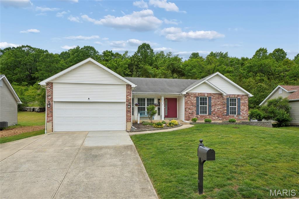 Back on the market at no fault of the sellers! This beautifully updated 3-bedroom, 2.5-bath ranch in the Sugar Creek Golf Community offers 2,843 square feet of total living space packed with  upgrades, including a brand-new roof (May 2026), newer HVAC (2019), and a newer water heater (2018). Inside, soaring vaulted ceilings frame a spacious great room and an eat-in island kitchen with newer stainless steel appliances, hardwood floors, and main-floor laundry. The primary suite serves as a private retreat with its own vaulted ceilings, walk-in closet, and a stunning, spa-like bathroom fully renovated in 2025. Entertain effortlessly in the professionally finished lower level, which boasts a massive rec room fit for a pool table, an impressive wet bar with a refrigerator, and abundant storage. Step outside to a private patio framed by a striking natural rock ledge and a serene wooded backdrop, perfectly situated just below the 6th hole.