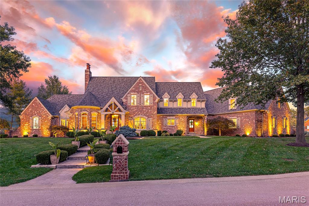 Distinctive design elements & superior craftsmanship define the architectural integrity of this spectacular French Country-inspired 1.5-sty. Impressive foyer leads to vaulted study, formal dining room & stunning great room with fireplace flanked by built-in bookcases & bank of windows that overlook resort style pool. Designer kitchen with 42” alderwood cabinetry, granite countertops, premium appliances & 9’ center island adjoins light-filled breakfast room & hearth room with wood-lined cathedral ceiling, entertainment center & stone fireplace. Coffered primary bedroom suite with spa-like bath offers an appealing retreat. The 2nd floor extends the living quarters with 3 additional bedrooms, 1 with ensuite bath & 2 with Jack n’ Jill bath, & bonus room. Lower Level includes recreation room with fireplace & its own “London Pub,” game room, media room, wine cellar & half bath. Situated on a .8-acre lot with pool, terrace & patio plus oversized 4-car garage & 2nd garage with service door.