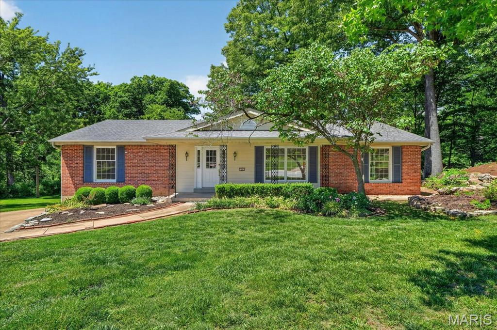 Nestled in the heart of Ballwin, MO—consistently ranked among the best places to live—this stunning ranch-style home in the sought-after Wildwood Subdivision is the perfect blend of modern updates and timeless charm. Designed as one of the largest floor plans in the neighborhood, this original-owner gem offers 4 spacious bedrooms, 3 full baths, and a warm, inviting layout—all on a single level for ultimate convenience.  Step inside to discover refinished oak hardwood floors that flow seamlessly throughout, complemented by elegant ceramic and marble bathrooms featuring heated floors for those chilly mornings. The large updated eat-in kitchen is a chef’s dream, ready to inspire your culinary creations. Need more space? The unfinished basement is a blank canvas, just waiting for your personal touch.  Plus, there’s even the potential to relocate the laundry to the main level for added ease.  Outside, your private backyard oasis awaits—perfect for morning coffee, weekend barbecues, or simply unwinding after a long day. The oversized two-car garage provides ample space for vehicles, storage, or hobbies.  Recent updates include:  retaining wall, refinished oak flooring, new carpet, new dishwasher, light fixtures in bedroom and closets, complete interior painting and exterior trim, sewer scope, cabling and repairs.  Don’t miss the opportunity to make this extraordinary property your own—schedule your private showing today!