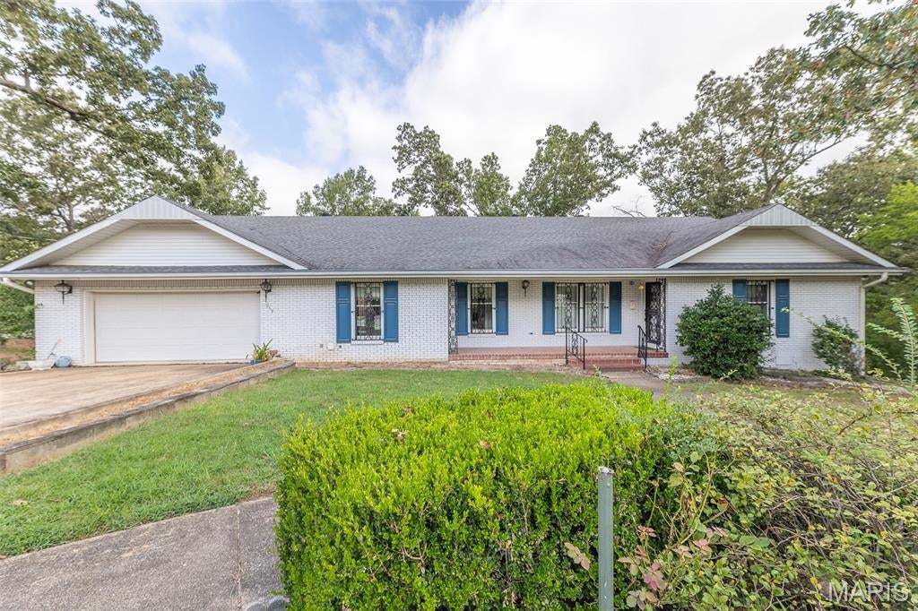 Offering nearly 3,000 square feet of spacious main-level living, this impressive 3-bedroom, 2-bath all-brick home combines exceptional space, privacy, and an ever-popular North Poplar Bluff location. Situated at the end of a quiet dead-end street, the property features a beautiful park-like yard surrounded by mature trees, providing excellent views and a peaceful setting while remaining convenient to everything North Poplar Bluff has to offer. Inside, you’ll find substantially sized living areas, generously proportioned bedrooms with oversized closets, and an expansive laundry room offering outstanding functionality and storage. The kitchen appliances are included, and the home is being offered furnished as-is for added convenience. Additional highlights include a new roof, oversized 2-car garage, partial basement, covered front and rear porches, and an expansive rear deck that’s perfect for entertaining or simply enjoying the private surroundings. With nearly 3,000 square feet on the main level, quality all-brick construction, tremendous room sizes, and a setting that’s increasingly difficult to find, this property offers an exceptional combination of space, location, and potential in one of North Poplar Bluff’s most popular areas.