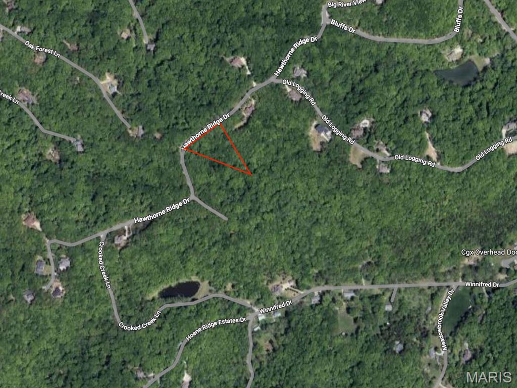 Nestled within The Bluffs, an established gated community in Eureka, this exceptional approximately four-acre homesite offers a rare opportunity to build your dream home in a private, scenic setting. Surrounded by rolling wooded hills and peaceful natural landscape. Residents of The Bluffs enjoy thoughtfully designed infrastructure, including asphalt streets, underground electric, central sewer, and clearly marked lot corners, all complemented by excellent architectural control that preserves the community’s character and long-term value. The neighborhood is known for its picturesque environment, highlighted by distant views of two lakes and an abundance of mature trees that create a sense of retreat while still providing convenient access to everyday amenities. Buyers have the flexibility to bring their own builder and customize their preferred floor plan, making this property ideal for those seeking a truly personalized home. Located within the highly regarded Rockwood School District, this lot combines privacy, natural beauty, and top-tier location advantages.