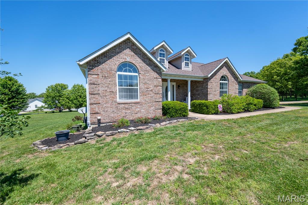 Beautifully maintained 3 bedroom, 3 bathroom home situated on over 3 acres offering space, comfort, and endless potential! Step inside to an open and spacious layout featuring wood floors, a cozy fireplace in the living room, and an eat-in kitchen with a beautiful bay window perfect for enjoying sunlit mornings. A separate dining room provides additional space for entertaining and gatherings. The primary suite is filled with natural light and includes a double vanity, soaking tub, and separate shower. Two additional bedrooms are located on the opposite side of the home, offering flexibility for families, guests, or hobby spaces. Downstairs, the full unfinished basement already includes a full bathroom and an additional garage, creating the perfect opportunity for extra living space, storage, or a workshop. Outside, the property continues to impress with a generously sized yard and an outbuilding featuring two parking spaces for equipment, vehicles, or additional storage needs. A wonderful opportunity to enjoy peaceful living with room to grow and make the space your own!