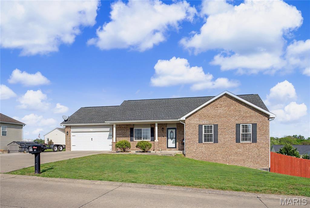 Enjoy the best of both worlds with this stunning ranch home located just beyond Jackson city limits—offering lower taxes while keeping you only minutes from all the conveniences of town. With nearly 2,500 square feet of finished living space, this home is thoughtfully designed for everyday living and entertaining, both indoors and out. Upon entry, you’ll find 4 spacious bedrooms and 3 full bathrooms, along with a nearly fully finished walk-out basement that provides additional living space and ample storage. Durable hard-surface flooring flows throughout the home, creating a clean, modern feel with no carpet anywhere—ideal for those with allergies or pets. The kitchen and everyday convenience features truly shine together. Enjoy granite countertops, gleaming backsplash, crisp white cabinetry, stunning light fixtures, and stainless steel appliances—perfectly suited for both daily living and hosting. Just steps away, the main-level laundry room adds ease to your routine, while the two-car garage with a tandem bay offers extra flexibility for storage, a workshop, or even that extended pickup truck. The expanded driveway includes additional poured concrete, providing plenty of extra parking for vehicles or guests. The exterior is equally impressive, featuring a classic brick front with low-maintenance vinyl siding on the remaining sides. Step out back to enjoy a massive, privacy-fenced in yard designed for both relaxation, comfort, and fun. Highlights include a deck with stairs, a concrete patio that leads to an above-ground pool with its own deck, a cozy fire pit, and plenty of open space for play or gatherings in the expansive backyard. Located in the desirable Jackson R-2 School District, this home truly has it all—space, style, and a location that offers the best of both worlds. You’ll love everything it has to offer!