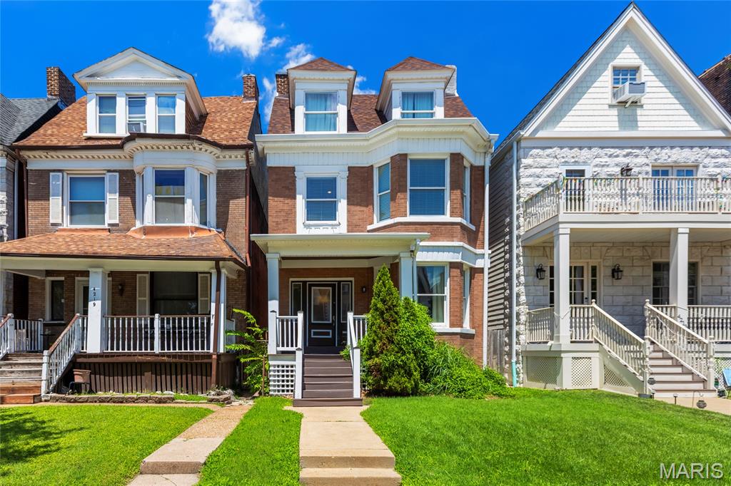 Few addresses in St. Louis offer what Maryland Avenue delivers. Tucked on a quiet cul-de-sac in the heart of the Central West End, 4215 Maryland puts you steps from the restaurants, coffee shops, and energy that make this one of the city's most coveted neighborhoods, while the street itself stays calm and residential. Forest Park is minutes away. The Cathedral Basilica frames your rooftop view. This is the kind of location people wait years to land.

The home makes an impression the moment you walk in. A grand staircase with ornate millwork, a stunning original fireplace with intricate carved surround, and rich dark hardwood floors set the tone for what this 1901 home is all about: character you simply cannot replicate. The formal living and dining rooms are genuinely generous, with the dining room easily seating twelve, and the updated kitchen delivers everything you need for modern daily life, including granite countertops, a stone-clad island with seating, stainless appliances, and a mosaic tile backsplash. The layout flows effortlessly from front to back.

Upstairs, the primary suite features beautiful bay windows, dark hardwood floors, and a completely renovated en suite bath with a soaking tub, double vanity, and stone tile surround that feels straight out of a boutique hotel. Second-floor laundry adds the everyday convenience you expect from a move-in ready home. The additional bedrooms are all well-sized, including a third-floor suite with the charming roofline character that makes older CWE homes so special.

The finished lower level adds serious bonus space, whether you want a rec room, home gym, additional storage, or all three. Out back, a fully fenced private yard and detached garage round out a package that checks every box.

Nothing to update, nothing to finish. Just move in and start living the CWE life.