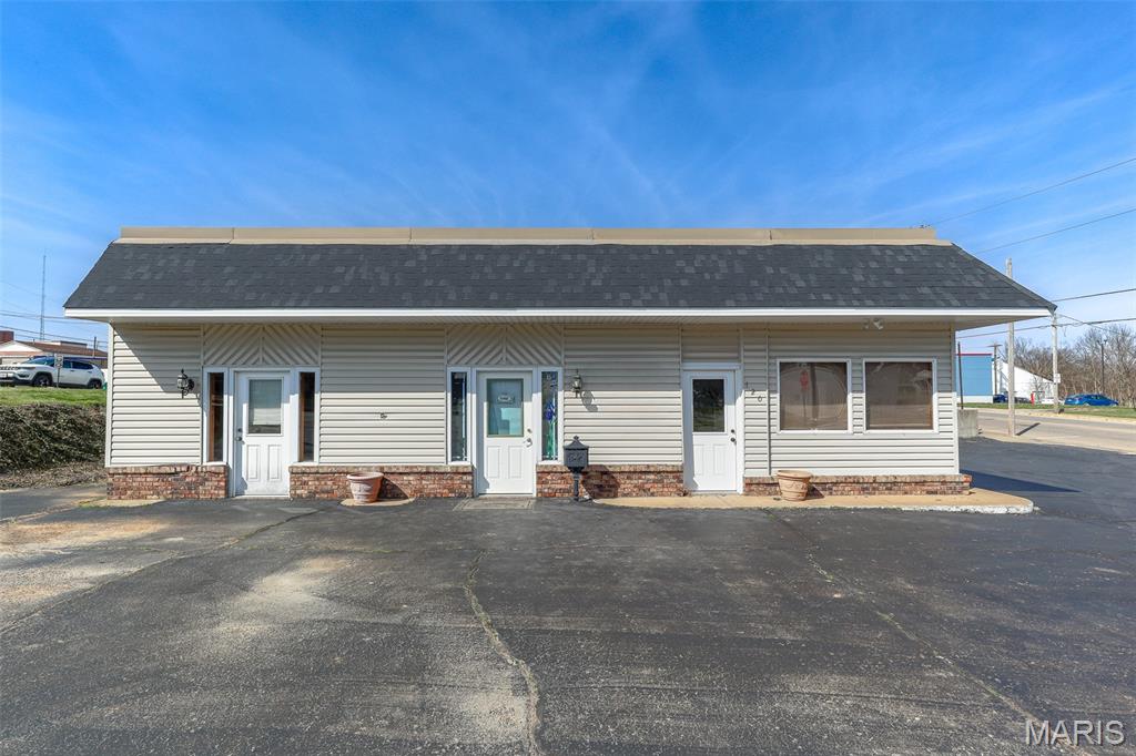 Commercial opportunity with endless possibilities! This versatile building is currently configured to accommodate up to three separate businesses, each featuring its own private office space, restroom, and entrance. The layout also offers flexibility to be opened up into one larger space, ideal for a single business operation with multiple private offices. The roof was updated approximately one year ago, and some new flooring has been recently installed.  Situated on a corner lot, the property provides ample off-street parking with close proximity to downtown Fredericktown. Perfect for investors or business owners looking to expand!