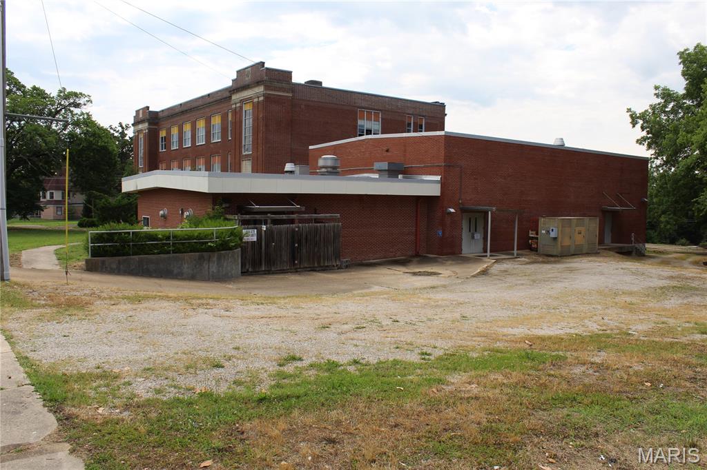 Multiuse Opportunity Zoned C2 investment property, includes gymnasium and attached commercial kitchen with vent hood converted into a 2 bedroom apartment and a 3 story school building with large commercial space facing Vine St, 4 large classrooms on the 2nd and 3rd story with separate bathrooms on each floor.  The 6007 square foot gymnasium with 600 Amp 3 phase electric and apartment are event ready and could even be converted into a restaurant.  There are separate bathrooms off the gym, and stage.  Two entrances off the gym lead into the 22,700 square foot 3 story school building.  2000 Amp upgraded electric service in good condition with lights and electric in every room.  School building does need new roof to save the truly unique local gem which is still being renovated and cleared out for your next dream investment with endless potential.