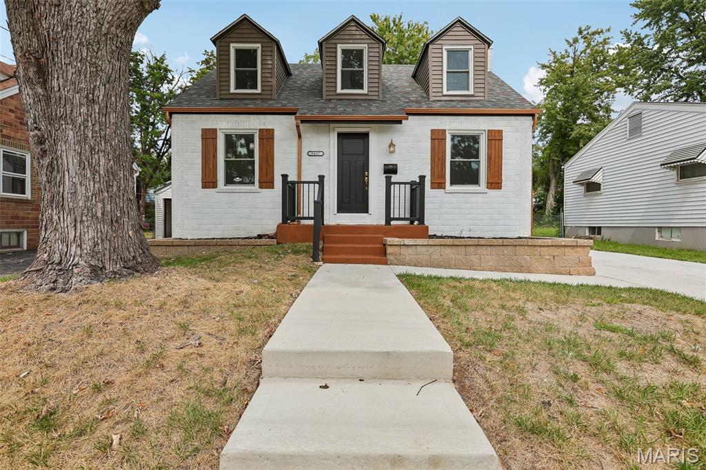 Completely renovated story-and-a-half brick bungalow in the Finke subdivision of St. John, offering 4 bedrooms and 2 full bath across 1,390 sq ft. Every major system in this home has been replaced, backed by permits from both St. Louis County (mechanical, electrical, plumbing) and the City of St. John (building). The main level opens into a bright living and dining area with new flooring and fresh paint throughout. The kitchen features green lower cabinetry and white uppers, granite countertops, and a full suite of new stainless steel appliances — range/oven, dishwasher, refrigerator and built-in microwave.Two main-level bedrooms and full bath complete the first floor, with two additional bedrooms upstairs under the roofline. The full basement offers a new 200-amp Eaton electrical panel with copper wiring, a new 40-gallon electric water heater, and a new Carrier forced-air HVAC system (installed January 2026) — all set up for future finishing or storage as-is. Exterior updates include a new roof (December 2025), new siding, new gutters, new doors, new fixtures, and a new driveway.  A current property survey from Marler Surveying Company is on file. This home is agent owned.