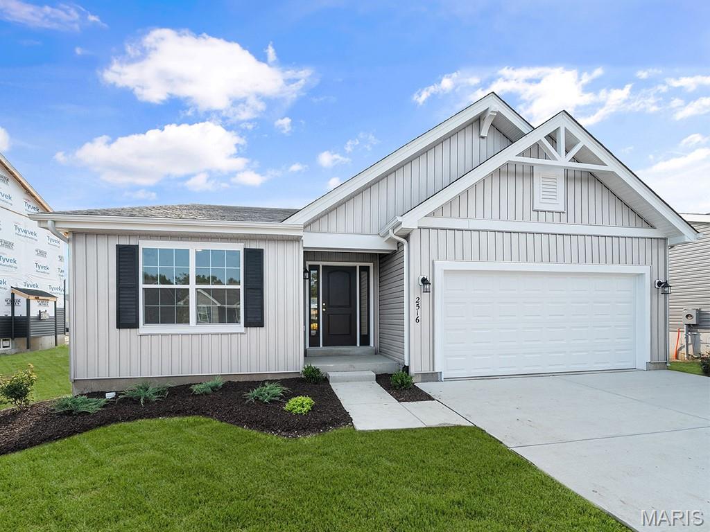 New McBride Homes Aspen II 3BR, 2BA ranch floorplan, is ready now! Farmhouse exterior & walkout homesite! Open floorplan w/vaulted ceilings, 6’ windows, & beautiful wood laminate flooring in main living areas. Kitchen has large island w/breakfast bar, level 4 Benton Painted White 42” cabinets, quartz countertops, stainless steel GE appliances, & walk-in pantry. The dining area has a sliding glass door that leads to a covered future deck area w/ceiling fan prewire. Primary suite offers dual closets, large window, ceiling fan, & private bath w/double sinks & walk-in shower. Other extras include main floor laundry, matte black fixtures, ¾ bath rough-in at lower level, ceiling fan prewires, six-panel doors, coach lights, & extended garage. Wildflower amenities include a sports court, pavilion w/picnic tables, fire pit, pickle ball courts, & BBQ pits. Enjoy peace of mind with McBride Homes’ 10 yr builders’ warranty & incredible customer service! Similar photos shown.