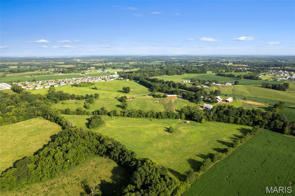 Welcome to a Rolling Hills Farm, a beautiful property in Gordonville
ideal for both lifestyle and income potential. 61+/-  breathtaking
acres, Rolling Hills Farm has been an asset to our community as one of
the area's finest equestrian facilities offering full-service boarding
and riding lessons with amenities for horse enthusiasts. The property
is thoughtfully designed with a 50' x 80' indoor riding arena, 100' x
200' outdoor arena, round pens, 26 stalls included with these 61
acres, tack room, feed room, and extensive fencing and cross-fencing
creating numerous paddocks and turnout areas. A live spring, and, in
addition to the automatic no-freeze waterers, a year-round creek
provide both beauty and dependable water sources, while the property's
proximity to county water offers outstanding future flexibility. The
indoor arena is equipped with a half bath and a wash rack with hot
water.  Whether you're searching for an equestrian operation or an
income-producing investment,  this remarkable property delivers a
combination of functionality and natural beauty. Properties in this
great location are hard to find. Located just ten minutes to Cape
Girardeau or Jackson.