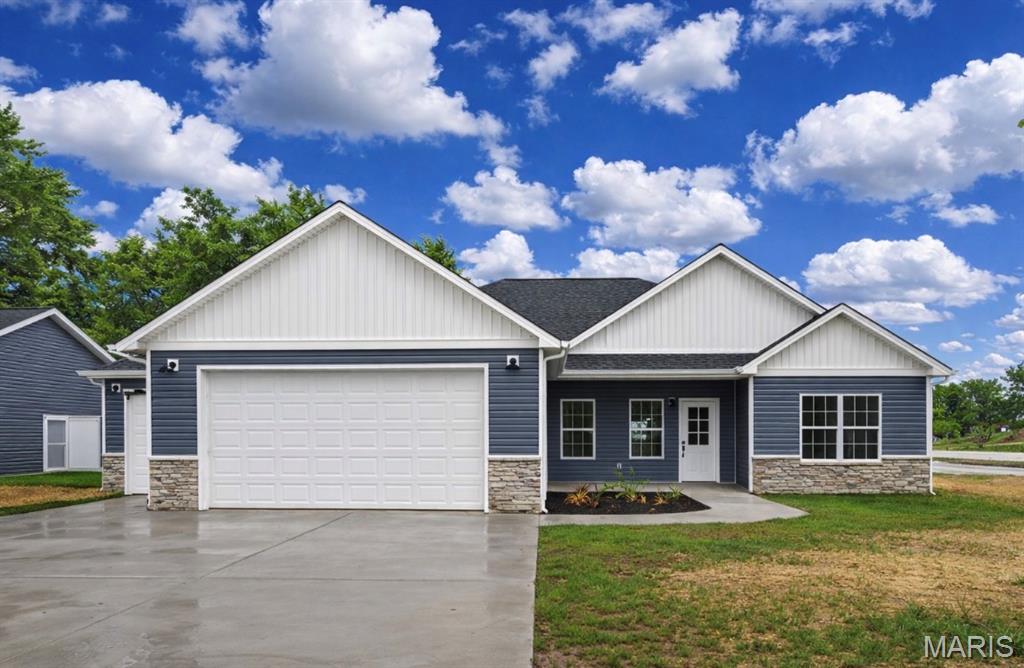 Stunning upscale new construction featuring 42" custom cabinets with crown, granite countertops, a waterfall smart sink, custom tile backsplash, and a shiplap-backed center island with breakfast bar. Enjoy 10’ ceilings in the great room, 9’ throughout, modern lighting, ceiling fans, and upgraded LVP flooring with plush carpet in bedrooms. The primary suite offers a spacious walk-in closet, luxurious bath with dual sinks, extra drawers, linen tower, tile flooring, a custom walk-in shower with glass doors, built in soap niche, and a water closet. Bedrooms 2 & 3 are large and include mirrored closet doors. Exterior highlights include a covered porch,  vinyl windows with decorative grills, a fully fenced backyard, and a 3-car insulated garage with garage door & keypad. Landscaping package included! Community amenities: dog park, trails, common ground with horseshoe pits—plus walkable access to local dining and school!
