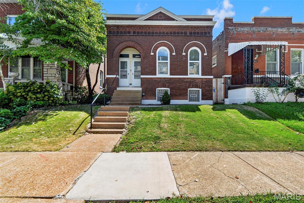 PASSED OCCUPANCY ! Move in ready....Welcome to 5406 Alaska Avenue! Charming St. Louis home with character, updates, and plenty of space! Step inside to a bright and welcoming open-concept layout featuring updated lighting, beautiful decorative wood accents, and an abundance of natural light throughout. The spacious kitchen is perfect for entertaining, offering granite countertops and a generous island that flows seamlessly into the main living area. The home offers two generously sized bedrooms plus a versatile bonus room downstairs that can be used as a home office, workout space, playroom, or additional living area. The updated bathroom features a stylish walk-in shower. Outside, enjoy a leveled backyard with a privacy fence and composite deck, creating a great space for relaxing, entertaining, or enjoying your morning coffee. The rear of the property also offers convenient off-street parking. With its combination of character, thoughtful updates, natural light, and functional living spaces, this charming home is ready for its next owner!