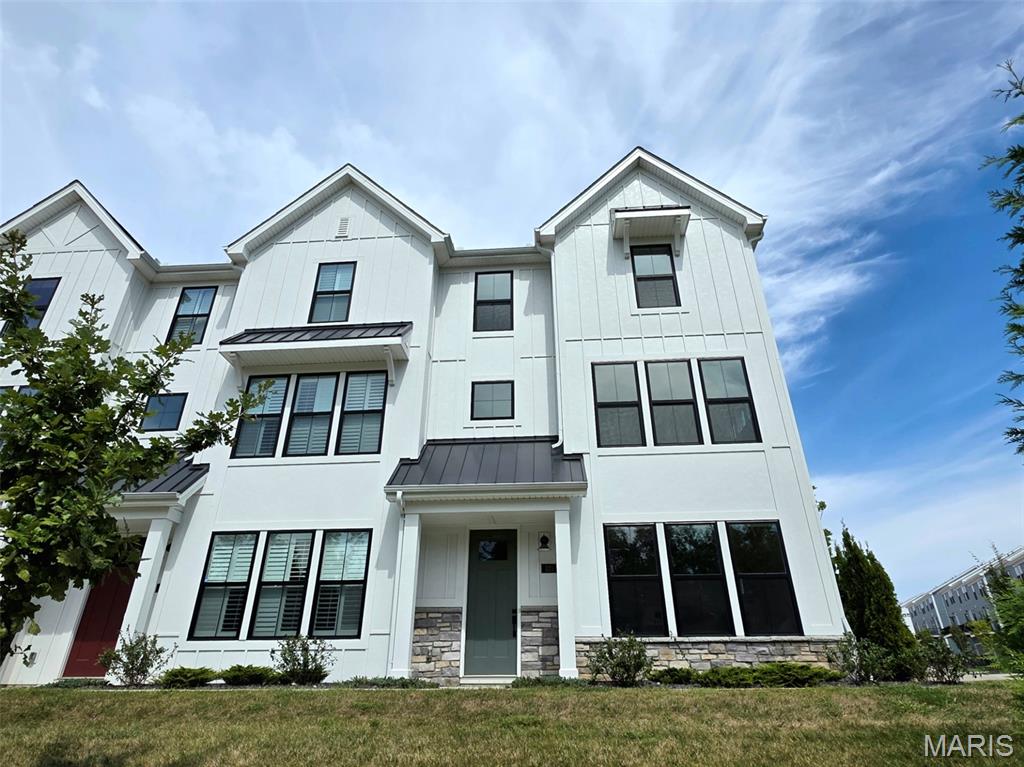 Rare End-Unit Opportunity in Wildhorse Village — Best Views in the Townes Welcome to this like-new Clifton floor plan townhome, offering the open-concept kitchen island and premium finishes — without the wait of new construction. Meticulously maintained and move-in ready, this home has seen minimal personalization, so it's ready for you to make your own! What sets this home apart from the rest of the community is its unmatched end-unit position. Unlike other units, no windows — including the deck — directly face into a neighbor's space, giving you a level of privacy that's hard to find in a townhome community. Combine that with a lake view from the deck, and you have one of the most desirable lots the Townes has to offer. Inside, upgraded luxury vinyl plank flooring runs throughout the entire home, including all of the bedrooms, meaning no carpet to replace and a clean cohesive look from room to room. The open-concept Clifton layout flows effortlessly between the kitchen, dining, and living spaces, ideal for entertaining or everyday living. Enjoy low-maintenance living in a vibrant community with lakeside views, close proximity to I-64, and easy access to shopping, dining, and top regional employers — all just minutes from downtown St. Louis.