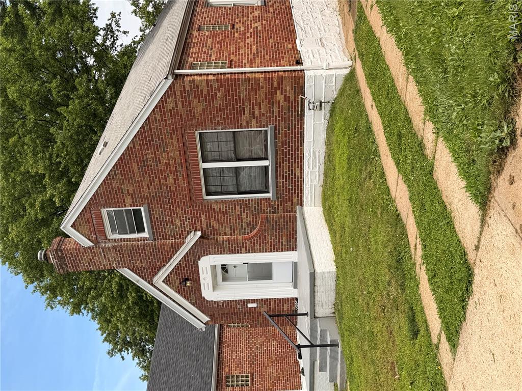 All brick home in a beautiful established neighborhood in historic St. Louis.  This house has great bones, and with a little TLC its true beauty will shine through!  2 beds on main level, sleeping room/den in partially finished basement.  Upstairs there is an open finished attic area.  Quick value add by adding one door and you have an instant 3rd bedroom and still a large bonus room area up there!  (Square footage does not include this space)  Super cute entry area and a large kitchen that is being under utilized.  Another value add opportunity!  The wood throughout the main level is in great condition.  Spruce up the bath, kitchen, and put a few finishing touches on the attic and basement and you have yourself a real charmer!  The details like arched door ways, stone fireplace, and stained glass/ glass block windows really make this home shine.  You'll also love the amount of natural sunlight that pours in.  If you're handy, or an investor, this is a wonderful opportunity to get into a home for an extremely affordable price!  One car garage and private drive for off street parking.  Home to be sold as-is, and buyer should verify all schools.