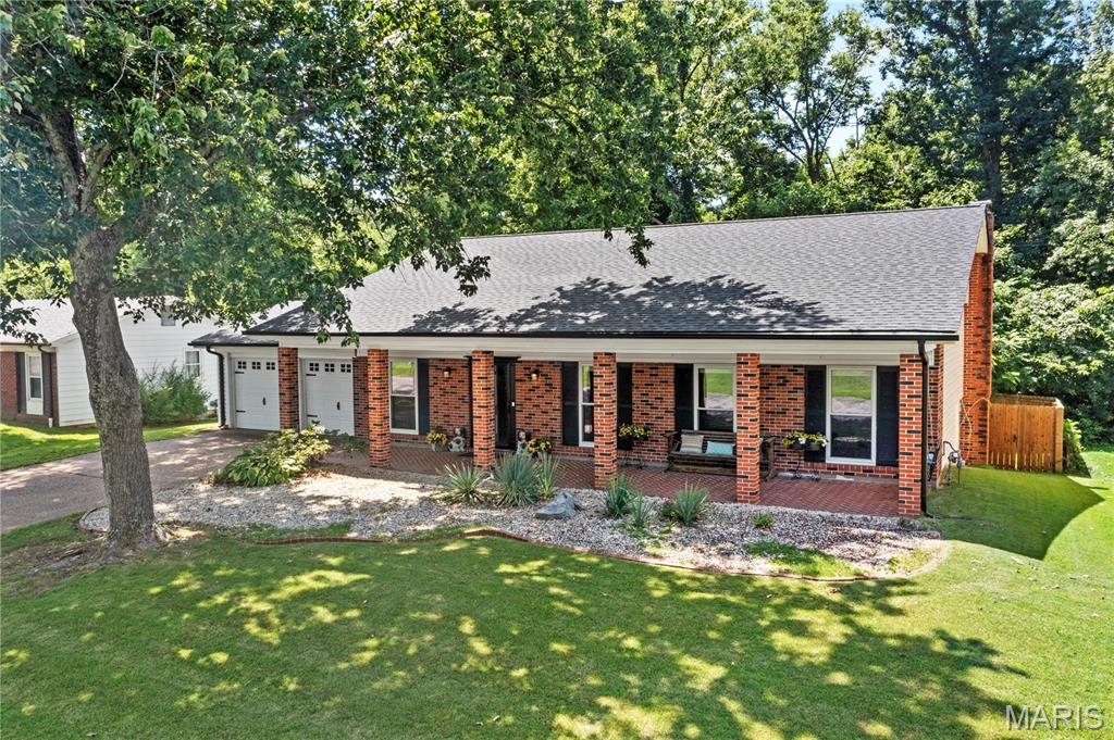 Welcome home to Oakville charm with all the right updates and all the right spaces.  This beautifully updated 1,920 sq ft home stands out from the start with brand new siding and a brand new roof, instantly boosting both curb appeal and peace of mind. The inviting and expansive front porch, gorgeous exterior presence, and undeniable charm make this one feel like home before you even step inside.

The moment you open the door, you’re welcomed by a desirable open floor plan designed for the way people actually live today—bright, connected, functional, and effortlessly comfortable. The flow of this home is one of its best features, with spacious living areas that feel open and airy while still giving each room purpose. Modern accents throughout add just the right amount of style, and new flooring brings a fresh, updated feel that ties everything together beautifully.

The main living spaces are ideal for both everyday life and hosting, with a layout that makes entertaining easy and natural. The walkout basement is a standout feature, offering the perfect extension of the home for gatherings, game nights, movie marathons, or simply extra room to spread out and enjoy. Whether you’re hosting a crowd or just want flexible living space, this lower level delivers.

The primary suite offers a comfortable retreat with its own attached bath, creating a private space to unwind at the end of the day. Outside, the backyard is ready for everything from quiet mornings to weekend get-togethers, complete with full privacy fencing for that tucked-away feel everyone loves. And the outdoor extras here are truly special—an incredible shed/bar with full electric adds endless possibilities for entertaining, hobbies, or the ultimate backyard hangout, while the gazebo creates the perfect spot to relax, sip your coffee, or enjoy evenings.

The 2-car garage, smart layout, and seamless flow throughout the home add the kind of everyday functionality that makes this one just as practical as it is charming.

And then there’s the neighborhood—because this one doesn’t just offer a great house, it offers a great lifestyle. Set in an amazing family-friendly community, you’ll love the picturesque neighborhood lake with its charming fountain, adding the kind of scenic backdrop and welcoming atmosphere that’s hard to find and even harder to leave.

This is the kind of home that checks the boxes and still has personality—the kind of place that feels warm, fun, stylish, and ready for its next chapter. Thoughtfully updated and full of character, this Oakville gem is one you won’t want to miss.