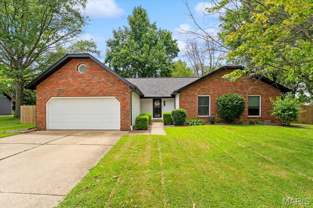Welcome to this beautifully maintained, move-in ready 3-bedroom, 2-bath brick ranch directly across from the lake. Located in the highly sought-after O'Fallon School District, this home offers an ideal combination of location, thoughtful updates, and functional living.

Inside, you'll find a spacious living room with vaulted ceilings and a cozy wood-burning fireplace. The updated kitchen features crisp white cabinetry, marble-look countertops, stainless steel appliances, and a breakfast nook with matching built-in cabinetry in breakfast nook for additional storage and serving space.

An enclosed bonus space just off the backyard offers flexibility for a home office, reading nook, hobby space, or convenient drop zone. The primary suite includes a private en-suite bathroom and plenty of room to unwind.

Step outside to a spacious, fully fenced backyard with a newer privacy fence, offering plenty of room to relax or entertain. Enjoy quiet evenings on the large stained wood deck, gather around the fire pit, or host on the patio. An attached 2-car garage, large storage shed, and seem less leaf-guard gutters add even more convenience.

With quality updates, versatile living spaces, and an unbeatable location, this home is ready for its next owners. Schedule your private showing today!