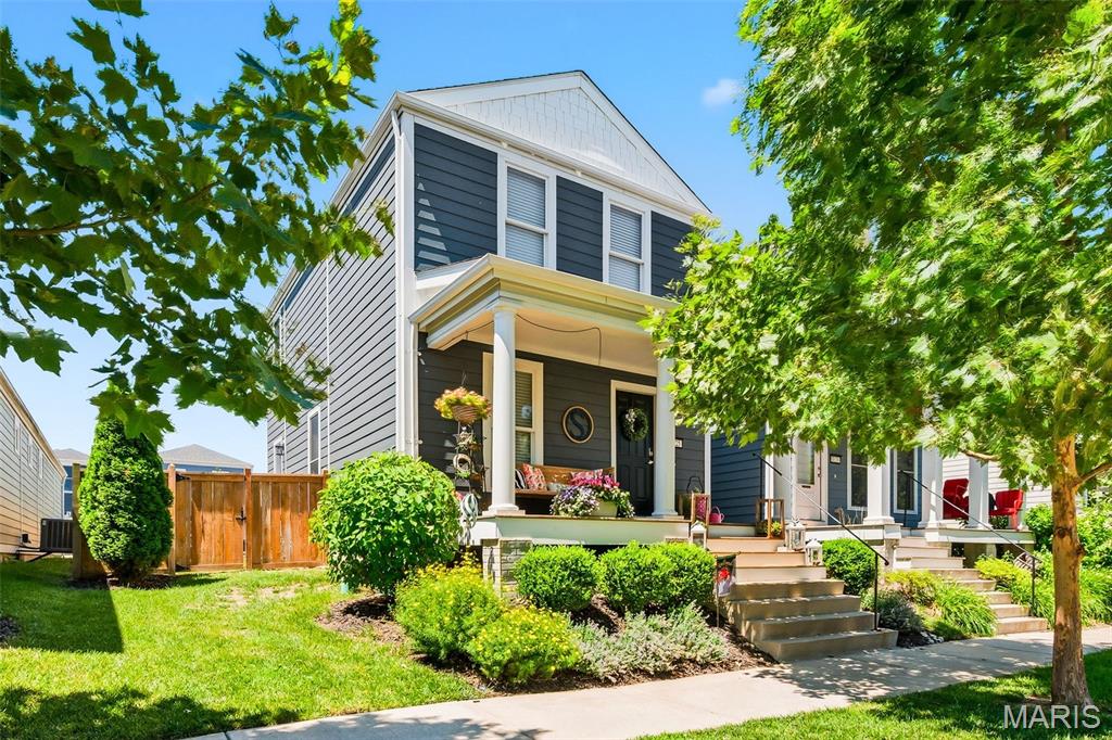 This well maintained home is located in the popular New Town at St. Charles community. Enjoy a neighborhood filled with shopping, churches, restaurants, pools, lakes, playgrounds, green spaces and more!  This 3 bedroom, 2.5 bathroom home is only 7 years old, with an amazing covered porch, oversized patio and fenced backyard, that's perfect for entertaining during the summer. The warm open floor plan allows for an easy transition from the living area to the dining area to the kitchen. The kitchen area has stainless steel appliances, backsplash, custom wood work and granite countertops. Upstairs you will find 3 bedrooms, including the Owners suite that features a walk-in closet and full bath and a convenient 2nd floor laundry room. Relax in the summer with movies, concerts, sand volleyball, shaved ice, ice cream & spending time in this amazing  community. New luxury vinyl plank flooring, carpeting and almost new HVAC system.  220 volt hookup installed in the garage for EV or workshop. Only minutes away from downtown St. Charles Main Street; highway 370, 270 & 70. You won't find another area like New Town, come make it home!