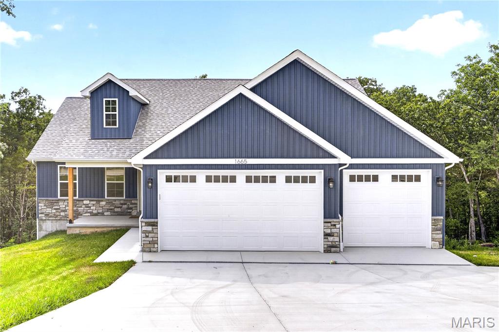 OPEN HOUSE SUNDAY 1-3PM *Builder is offering a $5,000 closing incentive for a successful closing in July.* This newly constructed custom built ranch home is situated on over a half-acre lot in the Festus School District. NO HOA restrictions! This home features exceptional build quality and high end upgrades that you won't find in other new builds in this area. This energy efficient home features a top of the line HVAC for an extremely low electric bill. All the interior walls throughout the home are insulated for noise reduction and privacy. This smart home also features a security system and all bedrooms are pre-wired for data connectivity. This split bedroom floorplan offers 3 bedrooms and 2 full bathrooms. When you walk inside from the covered front porch you'll notice the beautiful luxury vinyl plank flooring throughout the open concept living area. The living and dining area leads to a 12' x 14' composite deck, ideal for outdoor entertaining. The kitchen is thoughtfully designed with a large center island, granite countertops, upgraded soft-close cabinetry, marble backsplash, a walk-in pantry, and Samsung stainless steel smart appliances. The Alexa smart home system is compatible with the appliances for added convenience. Main floor laundry off the kitchen with tile flooring. The primary suite features a tray ceiling, beautiful walk in shower, double vanity sink with quartz counters and linen tower, and large walk in closet. The full walkout lower level offers a 9-foot pour, a dedicated vault/safe room, and a rough in full bath. Full egress provides excellent potential for additional future square footage. For extra peace of mind, the basement also includes drain tile, a sump pump & pit, and a 5 year waterproofing warranty. The fully finished 3-car garage is equipped with 8-foot insulated doors and an electric vehicle charging station. The extended driveway incorporated with drains includes an additional wing, providing convenient space for vehicle turnaround and easy street access. 2-10 builders warranty included.