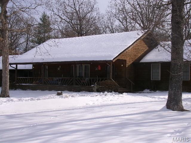 Come see this beautifully landscaped home sitting on 21 m/l acres. Property has a stocked pond with a gazebo overlooking it, lots of fruit trees, 2 nice garden spots,  There is fencing for your animals and a  1080 sq ft barn to keep them in. Behind the garage is a greenhouse. Lots of room for all your toys and equipment in the garage.  The home has 3 bedrooms and 2 full baths.  There is an open concept in the kitchen, living room, and dining room. There are high ceilings covered in wood. Kitchen has a center island , lots of  custom cabinets and all new appliances. Huge master bedroom with master bath a large walkin closet. Outside there is a covered front porch and a covered patio on the back. Great spot to sit and watch nature around you.