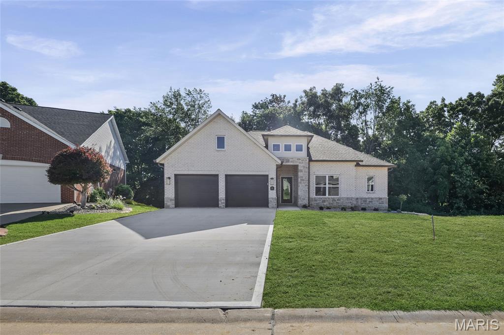 Welcome Home to this stunning new construction ranch home featuring 3 bedrooms, 3 bathrooms and a walk-out basement and zero entry garage.  Designed with modern living in mind, this home offers an open-concept floor plan, abundant natural lite and quality finishes throughout.  The spacious kitchen with Amish Cabinetry, quartz counters, an accented quartz back splash plus G E Appliances flows into the dining/living areas, creating the perfect space for gatherings and classic design.  The walk-out basement offers a large family room, 3rd bedroom & full bath plus ample storage space with direct access into the back yard.   The primary suite includes a private bath with a  zero entry shower & generous closet space.  Enjoy the benefits of new construction, energy efficient features and low maintenance living.  Upgrades include LVP flooring throughout home, tiled showers, quartz counters in kitchen & bathrooms, Delta faucets, custom fireplace mantel with stone surround, irrigation system, masonite doors plus custom drop zone with built-in bench as you enter from the garage.  Built by one of the Metro areas professional builders Spencer Homes,  you will impressed by their exceptional service and quality workmanship.  
Located in the private subdivision of Fountains of Sunset but just minutes from highway access.
