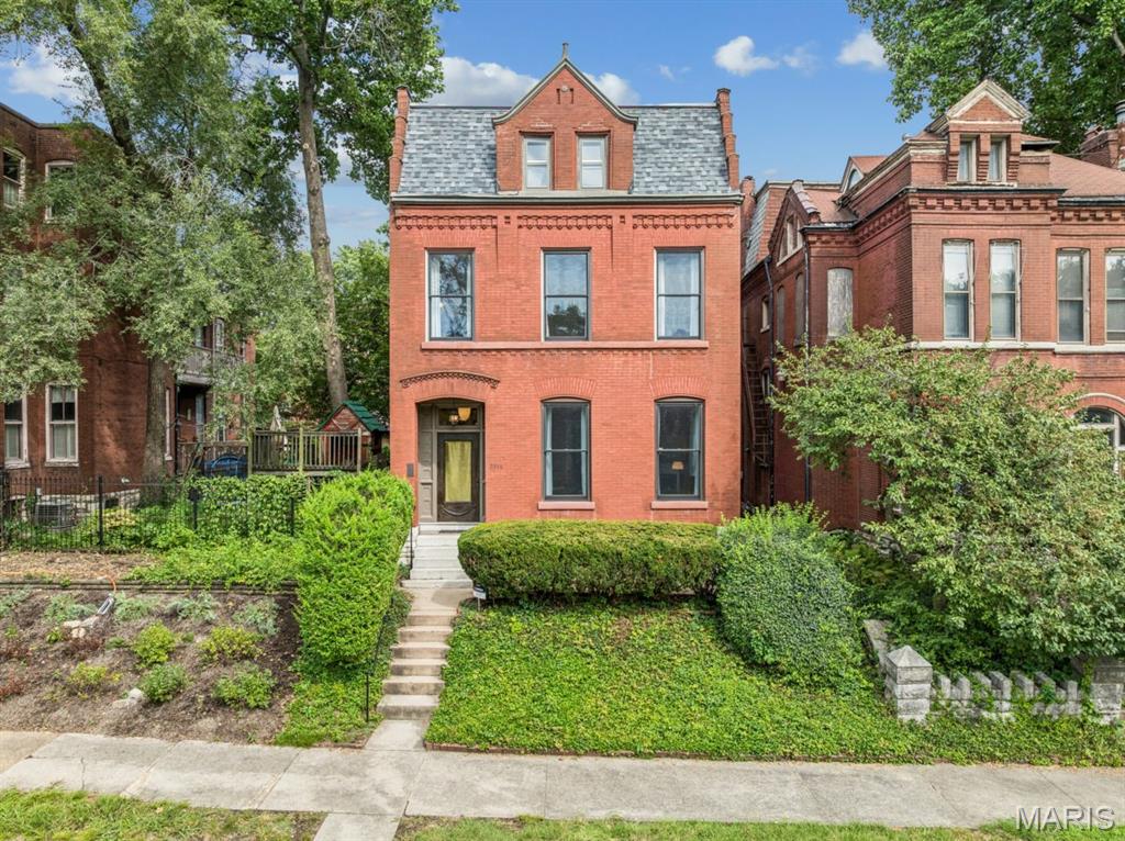 Step into a truly one-of-a-kind residence where over a century of history meets a refined European sensibility and an artist’s eye for preservation. Thoughtfully renovated by long-time stewards, this home balances its original character with modern, museum-like quality that create a gallery backdrop for everyday living. Natural light pours in through skylights above the staircase, evoking the feel of an abstract installation, while the main level offers a generous living and dining space that flows effortlessly into a Bulthaup custom designed eat-in kitchen. The rear of the home opens dramatically with 10-foot glass doors, creating seamless indoor-outdoor connectivity and inviting the outside in. Upstairs, the second floor features a serene bedroom and office, both overlooking the lake at Benton Park. Another bedroom with huge walk-in closet offers a striking glass-encased, east-facing studio—perfect for creative pursuits. The third-floor primary retreat feels like a private sanctuary among the treetops, infused with relaxed bohemian charm and a 3rd view of the lake at Benton Park. There is another den area + large storage room up here. The rear garden is a lush, Missouri Botanical Garden–inspired oasis—an immersive, ever-changing landscape that completes the home’s unique spirit. Every inch has been carefully considered and lovingly maintained, resulting in a property that transcends the ordinary. It’s rare to encounter a space with such presence—an intangible that must be felt to be fully understood. See list of updates in supplements.