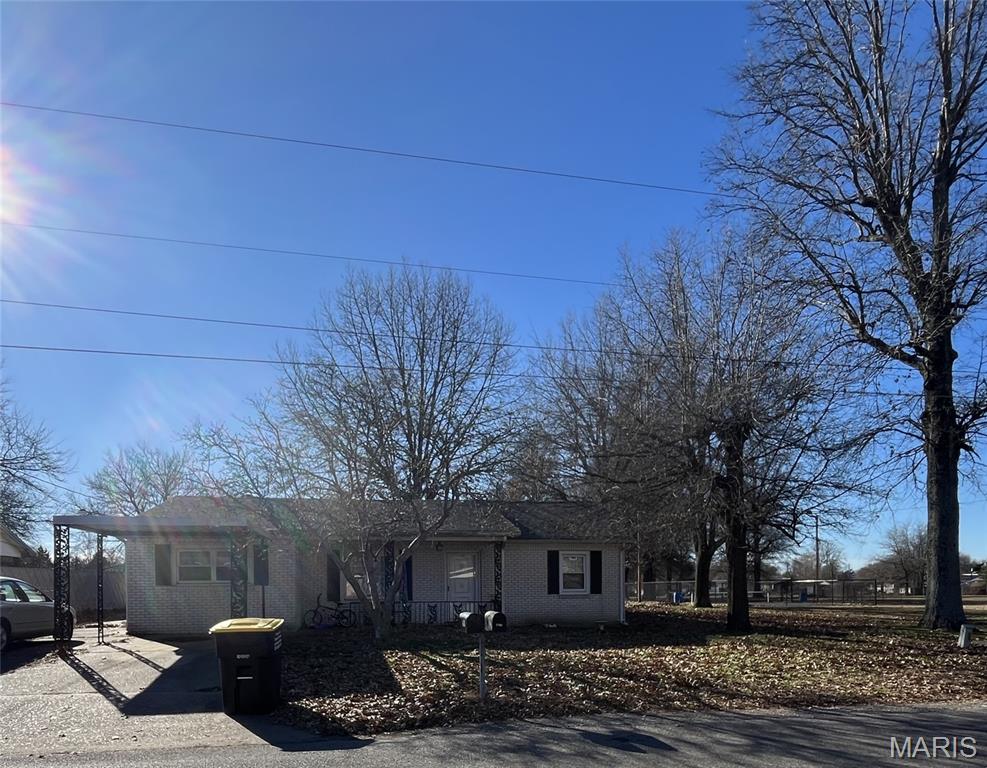 A white brick home with 2 large bedrooms, 2 bathrooms, a living area, a kitchen, a storage area, a 1 car carport, and detached garage. Home is located right next to a local park making it the perfect location for you and your family to get fresh air. It has a decent sized yard with a storm shelter in the back. With a little TLC this home could be just what you need! Lot Size 75*200 Shown by Appointment only.