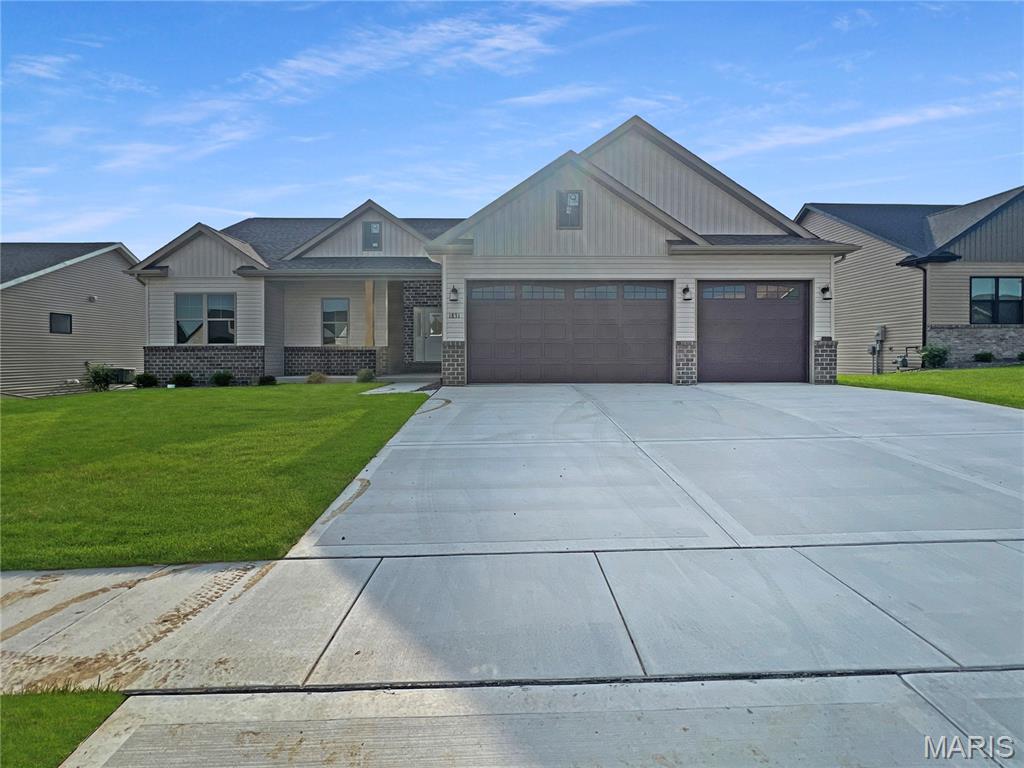 Beautiful new construction home offering the space, layout, and modern finishes today’s buyers are looking for! Located at 1831 Wellington Lane in Maryville, this 4-bedroom, 3-bathroom home features a functional floor plan with stylish details throughout.

The main level includes a spacious living room, kitchen with solid surface countertops, stainless steel appliances, pantry, and convenient main floor laundry. The primary suite features an attached private bathroom and walk-in closet, while two additional bedrooms and another full bathroom complete the main level.

The finished walk-out basement adds even more living space with a large family room, 4th bedroom, 3rd full bathroom, and additional storage area - perfect for guests, entertaining, or everyday flexibility. Outside, enjoy the covered deck overlooking the backyard, along with the convenience of a 3-car garage.

With quality finishes, a spacious layout, and new construction peace of mind, this home is one you won’t want to miss!