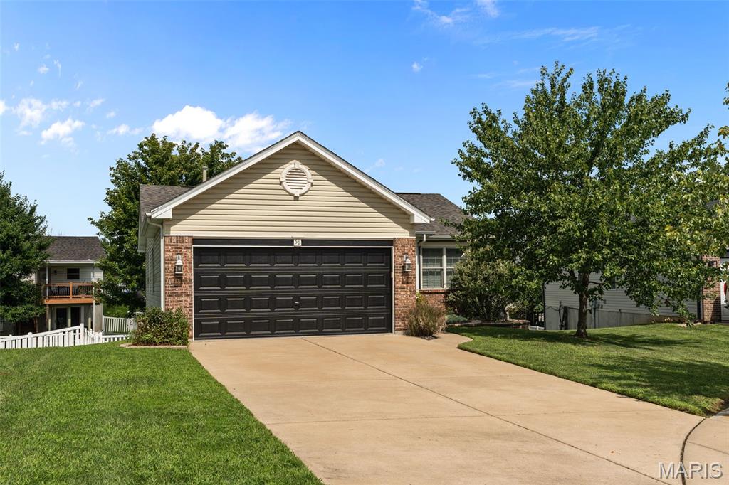 Welcome home to this beautifully maintained and updated ranch in the highly desirable Homefield Terrace neighborhood! This move-in-ready home features an inviting open floor plan, hardwood flooring throughout the main level, neutral paint, and numerous thoughtful updates.

The spacious eat-in kitchen offers newer stainless steel appliances, custom cabinetry, and ample counter space. The main level includes three generously sized bedrooms, including a primary suite with a private bath and walk-in closet. The living room is highlighted by an electric fireplace installed in 2022, creating a warm and inviting focal point.

The recently finished walk-out lower level provides even more living space with a spacious family/rec room, a true fourth bedroom with its own ensuite bath, plenty of closet and storage space, and a cozy gas fireplace.

Outside, enjoy the level, fully fenced backyard with a patio beneath the new deck installed in 2024. Additional major updates completed in 2024 include a new roof and newly installed epoxy garage flooring, adding both durability and a clean, finished look to the garage.

Conveniently located just minutes from Highway 70, shopping, dining, and entertainment, and within the desirable Fort Zumwalt School District. With its spacious layout, major updates, and excellent location, this home is truly move-in ready.

Don't miss your opportunity to make this one yours!