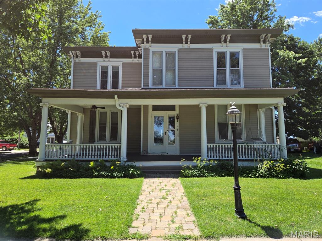 Classic features here - this beautiful Victorian offers modern updates combined with so many of the beautiful original features on an oversized corner lot on quiet College St.   You'll love the hardwood floors, thick trim, leaded glass, wood doors & charm throughout, and will appreciate the zoned HVAC, big rooms, new kitchen, screened porch & composite back deck.  Step inside the front door to the original entryway which leads to a spacious living room, nice dining room, and back to the updated kitchen featuring new cabinetry, a big island, tile backsplash, and all stainless steel appliances convey.  A spacious sitting room/office area is certainly big enough to be a full bedroom on the main level, and you'll appreciate having a full bathroom, storage room and the screened side porch is the perfect spot for morning coffee or evening visits.  Upstairs you'll find a master suite with double walk-in closets and a full renovated bathroom with walk-in shower.  Two more bedrooms, a full bath and nice laundry room are also on the second level.  The basement houses the utilities.  Take advantage of the back deck on summer nights, which leads out to the oversized 24x30 2-car garage/workshop, which has heat & air and is the ideal mancave.  All of this on tree-lined College St, just a short walk to Culver-Stockton College or downtown attractions. So many updates here make this a truly move-in-ready home: new roof in 2025, porch roof in 2022, deck/screened porch 2021, updated pex water lines, garage in 2024 and painting/trim work in 2026. 

Utility providers here include Ameren Electric, Liberty Gas, City of Canton water/sewer/trash, and both Rise & Brightspeed Fiber are available.