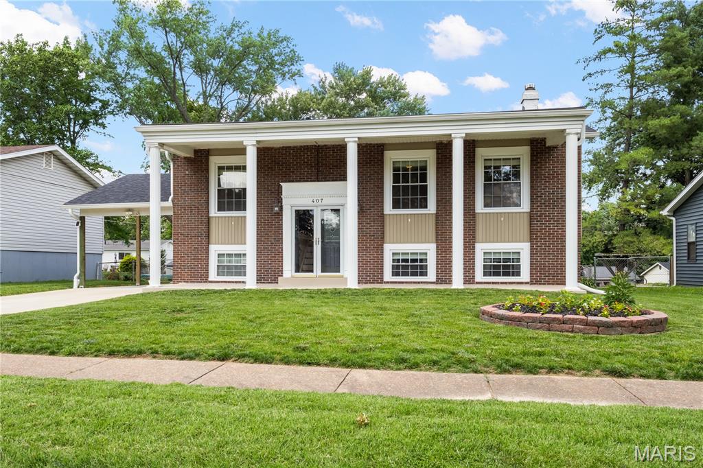 Welcome to your beautifully updated West County retreat! Nestled in the heart of Ballwin, this 4-bedroom, 2-bathroom home blends a bright, versatile floor plan with stylish modern upgrades perfect for today’s lifestyle. Step inside to find a spacious, light-filled living and dining areas featuring gorgeous real wood flooring and elegant stair railings. The fully remodeled kitchen is a chef’s delight, complete with newer wood cabinetry, solid surface countertops, a pantry, and premium stainless steel appliances including a gas range and a spacious French-door refrigerator. Just off the kitchen, walk out onto your expansive deck. It overlooks a flat, fully fenced backyard that is just waiting for summer BBQs, pets, and yard games. The main level hosts three generously sized bedrooms, all equipped with ceiling fans and beautiful wood floors. Head downstairs to discover the massive fourth bedroom, previously utilized as a private Primary suite and a large, cozy family room. Double doors open to a newer, wrap-around stamped concrete patio (2022), offering a seamless indoor-outdoor flow for relaxing or entertaining. 
Additional perks you’ll love: Both full bathrooms have been tastefully updated.  Ample storage and a dedicated laundry area with direct exterior access, Recessed lighting, freshly painted lower level, newer carpet LL (2026), Newer roof and gutters (2024) Hot water heater (2026) Low-maintenance vinyl siding and a deep, covered carport. Unbeatable location! A Short 3 minute Walk to Sorrento Springs Elementary, and easy drive to local parks, fantastic shopping, and easy Hwy 141 access. This turnkey gem offers the perfect mix of community, space, and modern comfort. Schedule your tour today and move right in!