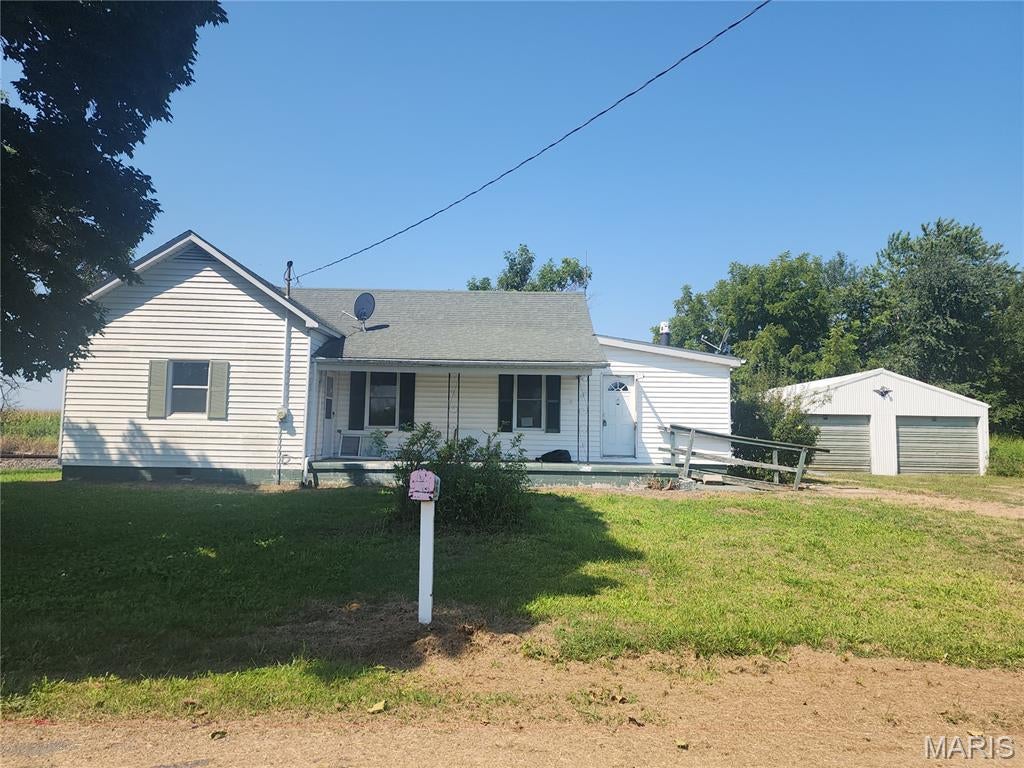Looking for a little space away from it all while still having convenient access to nearby shopping and amenities? This property could be the one! Offering an estimated 1,260 square feet of living space, per public records, this home provides plenty of opportunity to make it your own. Inside, you'll find 3 bedroom,1 bath, main-floor laundry, an open kitchen, and a spacious floor plan ready for your personal touches. Need garage space? The estimated 38' x 22' detached garage offers plenty of room for multiple vehicles, hobbies, a workshop, or additional storage. Surrounded by farm fields and approximately 13 miles from shopping and amenities in neighboring Jerseyville, this property offers a rural setting without being too far from town. The home is located in close proximity to railroad tracks, making it an especially unique setting for the train enthusiast who enjoys country surroundings. Property is being sold AS-IS. Seller will make no repairs. Buyer/Buyer's Agent to independently verify square footage, measurements, property information, and all public record information prior to submitting an offer. Information has been obtained from multiple sources and is believed to be reliable but is not guaranteed. Also known as RR Box 111 Kane.  No information known about well on property