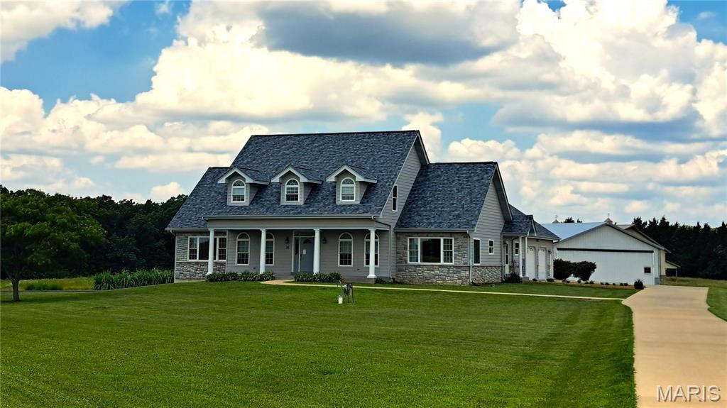 Open House Saturday, August 22nd from 11am to 2pm. 
House - Aircraft Hangar - Grass Runway 
Welcome to 25 Barnstormer Lane, Foristell, MO 63348 (Unincorporated St. Charles County) - A Rare Aviation Estate in Woodliff Airpark (FAA Identifier: 98MO)

Calling all pilots and aviation enthusiasts! This exceptional custom home is located in the exclusive Woodliff Airpark, a private fly-in community in St. Charles County. Taxi your aircraft directly to your own 60' x 60' private hangar and enjoy the convenience and lifestyle that only an airpark can offer.

Move-in-ready home situated on 5+ acres with breathtaking runway views, built in 2009, offers 4 bedrooms and 4 bathrooms, 2 full baths and 2 half baths.

Step through the front door into a two-story foyer featuring a hardwood staircase. Hardwood flooring throughout the main living areas, abundant natural light from oversized picture windows overlooking the runway, and an open floor plan.

The spacious kitchen and breakfast room feature Corian countertops, a center island, electric cooktop, double ovens, dishwasher, garbage disposal, pantry with automatic lighting, recessed lighting, and tile flooring. A formal dining room provides additional entertaining space.

The oversized main-floor laundry/mudroom with built-in cabinetry and a utility sink.

The main-level primary suite includes two large rooms (bedroom/den/office/sitting room), two oversized walk-in closets, and an impressive bathroom with double vanities, separate shower, and a brand-new handicap-accessible walk-in jetted tub with entry door.

Also on the main level are two convenient half bathrooms and access to an expansive unfinished storage area above the oversized two-car garage (800 Sf).

The upper level features three bedrooms with charming dormer windows, ample closet space, ceiling fans in every bedroom, additional unfinished storage, and a full hall bathroom.

The full basement with walk-out exterior access (unfinished)(2,248 Sf) offers endless possibilities for future expansion. It is roughed in for a full bathroom, includes heated floors, abundant storage shelving, excellent lighting, and a sump pump.

Additional features include:
High-efficiency geothermal HVAC system
Heated basement floors
Double water heaters with on-demand hot water
Roof replaced in 2026
Double-pane thermal windows
Three-phase well pump
Water softener
Central vacuum system
Ceiling fans throughout

Aviation enthusiasts will appreciate the outstanding 60' x 60' (3,600 Sf) insulated hangar featuring metal roof and metal siding. The aircraft hangar measures approximately 60' x 45' with a 40-ft-wide Hydrolift aircraft door (single panel), 12-ft door height, 12-ft ceilings, excellent lighting, water service, electrical service, and plumbing stubbed for a future bathroom. An additional 60' x 15' bay with a single garage door provides ideal space for vehicles, equipment, workshop, additional storage, or could easily be finished into an office or hobby space.

The beautifully landscaped property is accessed by a 1,400-foot paved private road. The aircraft parking apron and main driveway are concrete, while the rear drive is asphalt. With more than 5 level acres, there is ample room to add a swimming pool, tennis court, or additional outdoor amenities.

Woodliff Airpark (FAA Identifier: 98MO) is one of Missouri's premier private residential aviation communities centered around a lighted 2,800-foot grass runway with approximately 2,500 feet of overruns. This remarkable community offers a rare opportunity to enjoy the freedom of living where you fly.

Whether you're looking for an exceptional aviation property, a private country estate, or a one-of-a-kind lifestyle, 25 Barnstormer has it all!

Set up a viewing today!