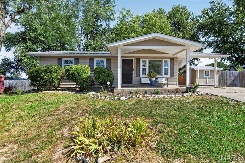 Location…location!  This ranch-style home offers updates with a setting that’s hard to beat. A carport with attached shed provides both parking and storage, a large, level fenced backyard with 2 additional sheds and a covered patio for all your outdoor needs.  Inside you’ll find lots of updates like flooring, appliances, fixtures, doors, etc. Living room has a bright, airy feel with a large picture window. The kitchen is as functional as it is charming with stainless steel appliances, tile backsplash and direct access to that huge backyard perfect for outdoor entertaining. The main floor includes 3 generous sized bedrooms and an updated bath. Updated lighting adds a modern touch throughout the home. Downstairs, the mostly finished basement expands your living space with plenty of room for relaxing, hobbies, or a home office plus a full bath. This is a move-in ready home that combines thoughtful updates with an exceptional lot.  This one won’t last long and is ready for you to call it home.