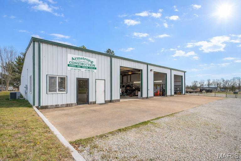 This versatile commercial property offers an excellent opportunity for a variety of business uses, featuring a spacious shop building with three overhead garage doors and a well-designed layout to support daily operations. Inside the shop, you’ll find generous workspace with tall ceilings, providing ample room for equipment, vehicles, or fabrication. The interior includes a dedicated office space, a welcoming lobby area for clients or customers, a functional kitchen/breakroom area, and two separate bathrooms—adding convenience and comfort for both staff and visitors. At one point and time, the last garage stall was separated for retail purposes making this a great opportunity to run several businesses out of.  Outside, the property features expansive parking and maneuvering space, making it ideal for trucks, trailers, and heavy equipment. Multiple covered exterior areas provide excellent sheltered storage for materials, equipment, or vehicles while keeping them protected from the elements. Whether you’re looking to expand an existing business, start a new operation, or invest in a flexible commercial property, this property offers the space, functionality, and infrastructure to meet a wide range of needs.